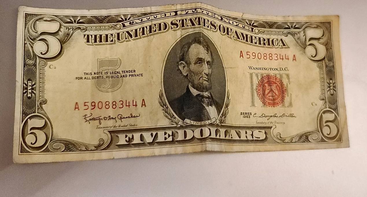 Is a red dye stained $5 bill common?