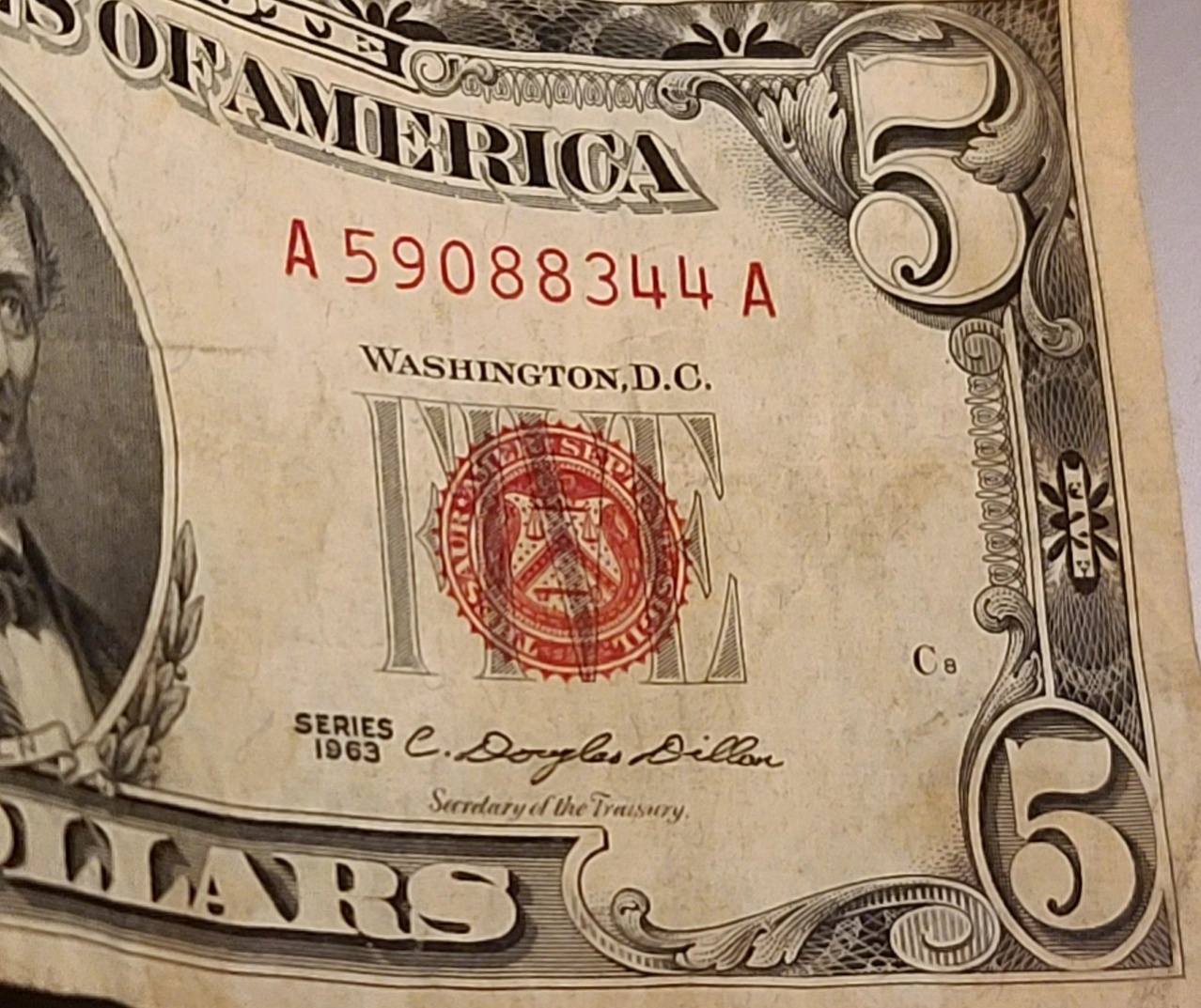 Is a red dye stained $5 bill common?