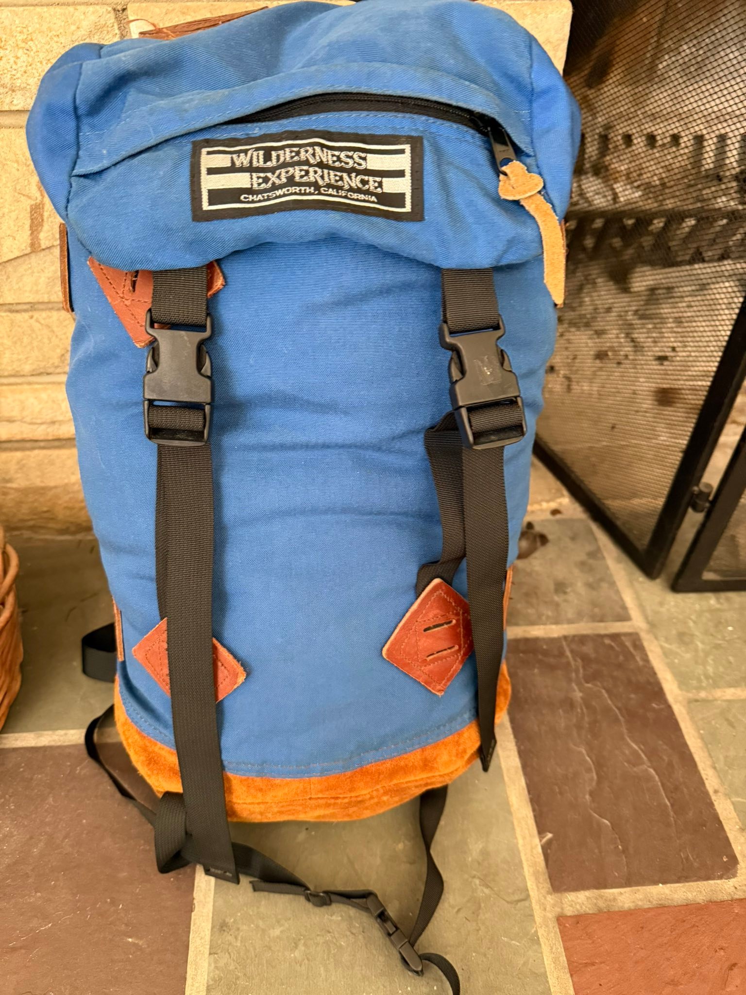 Repairing vintage backpacks with leather patches
