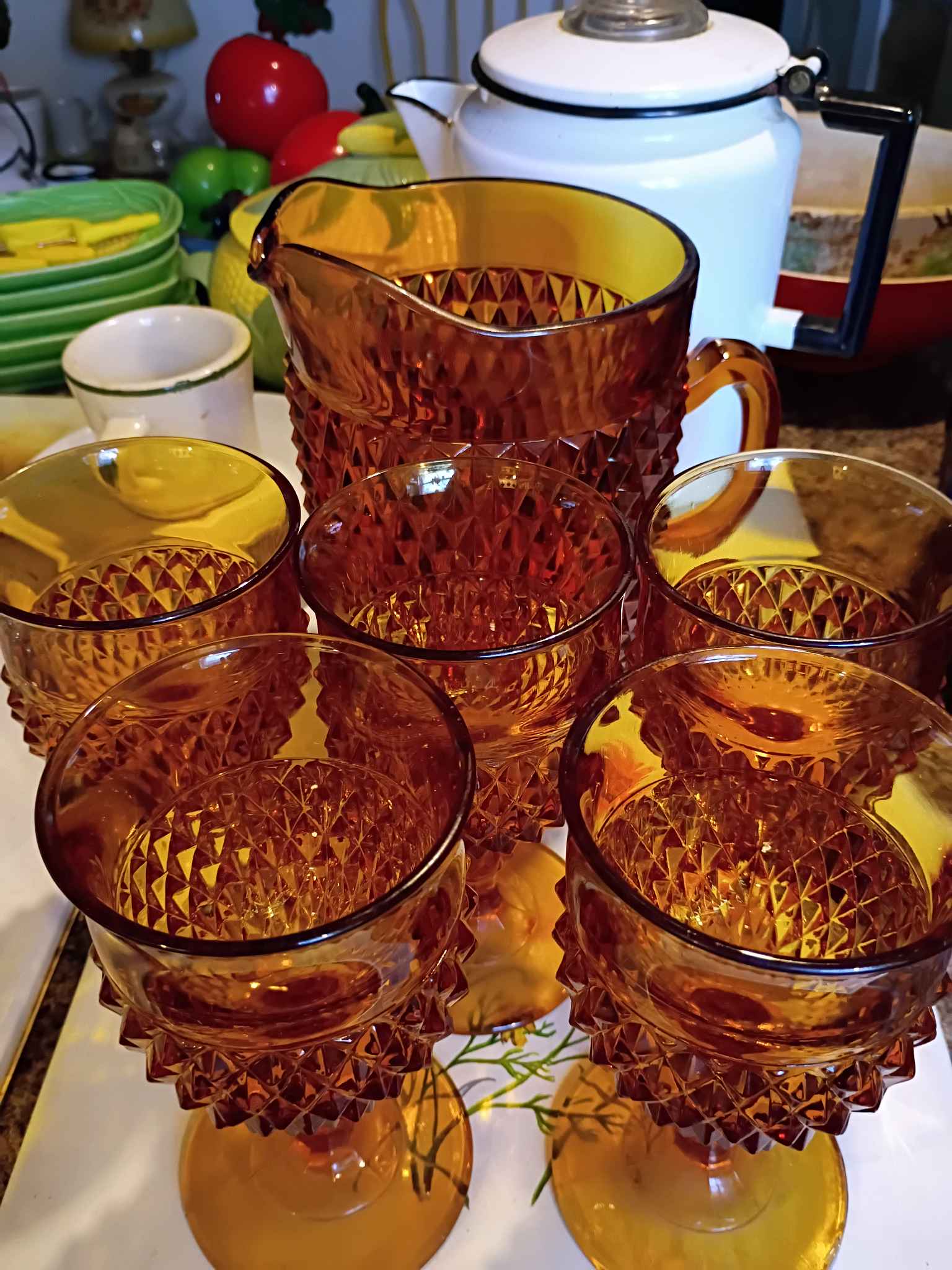 Beautiful amber glass pitcher and matching glasses set. Has a cool