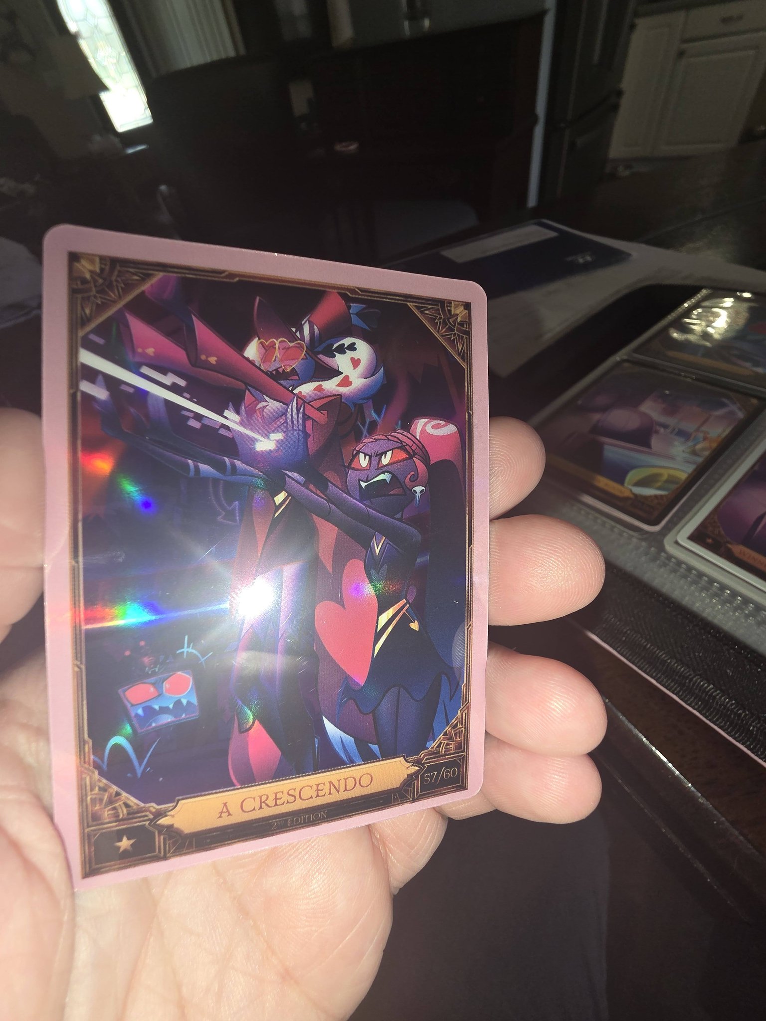 Foil Adam and Baxtor cards from Hazbin Hotel