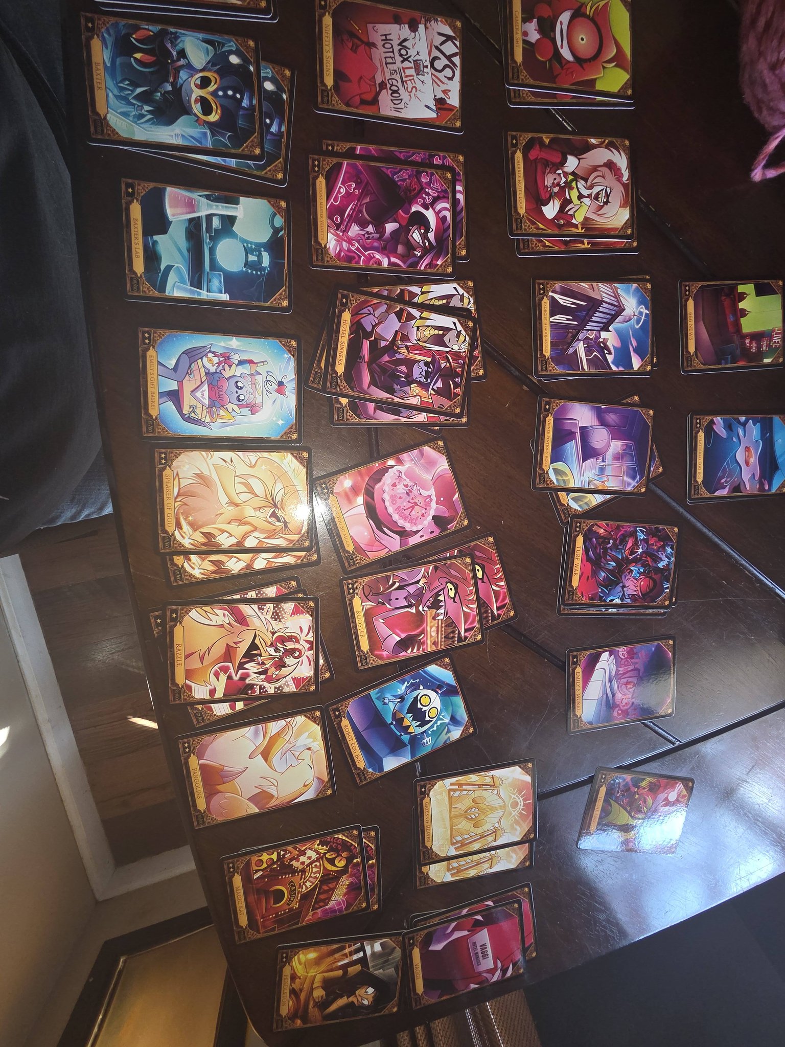 Foil Adam and Baxtor cards from Hazbin Hotel