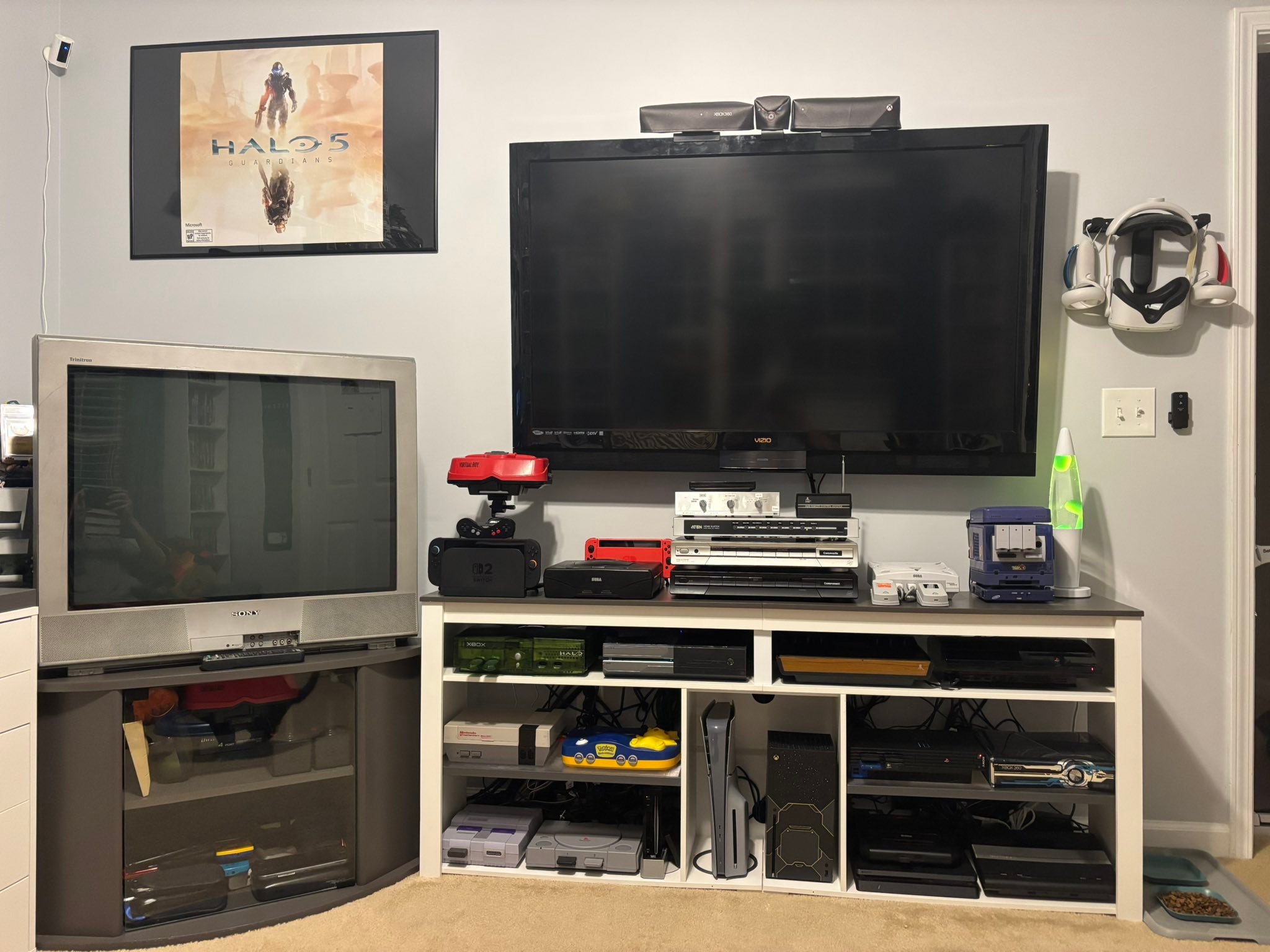 80s home entertainment setup with multiple consoles