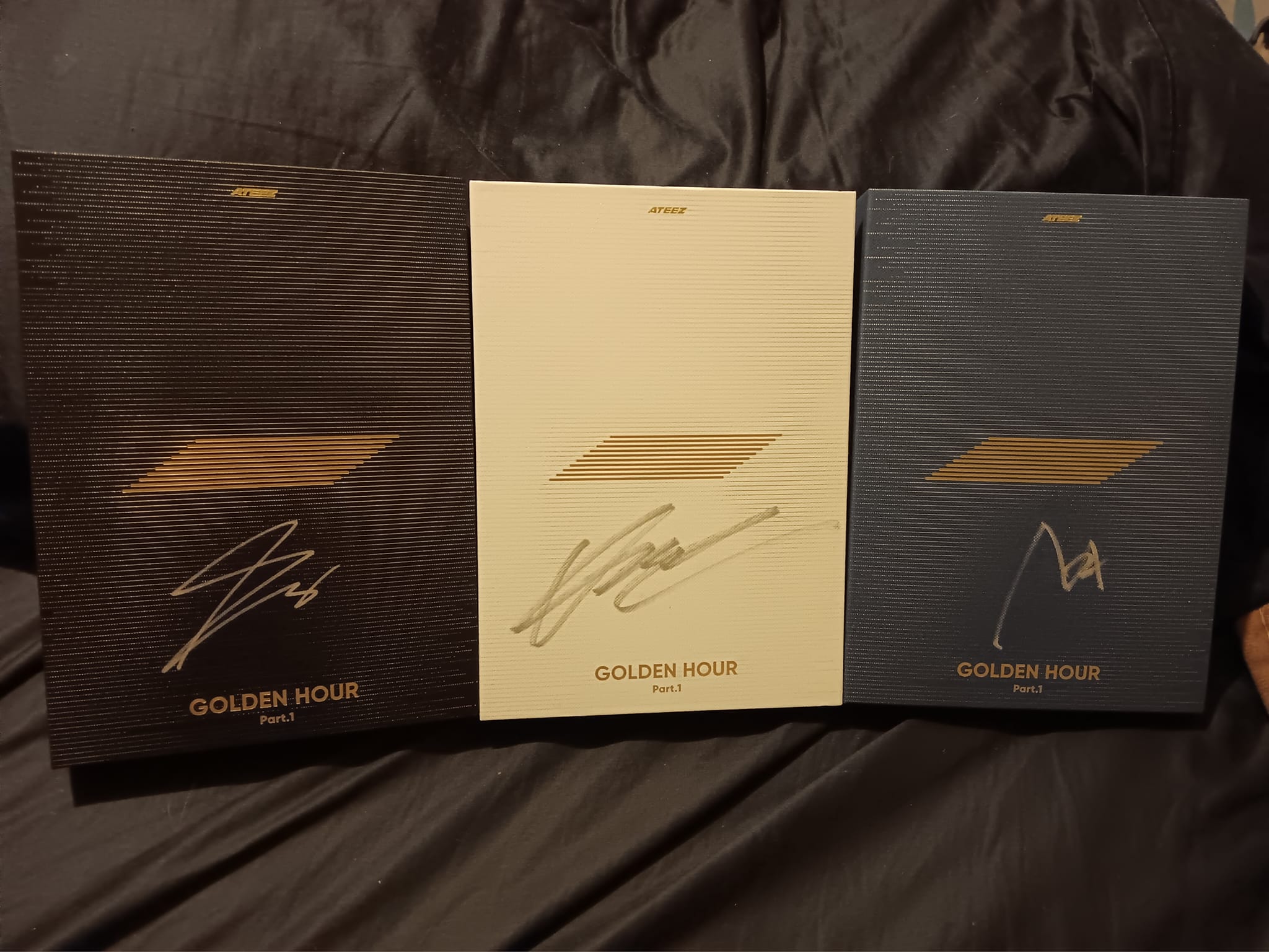 Ateez members' signatures on poster