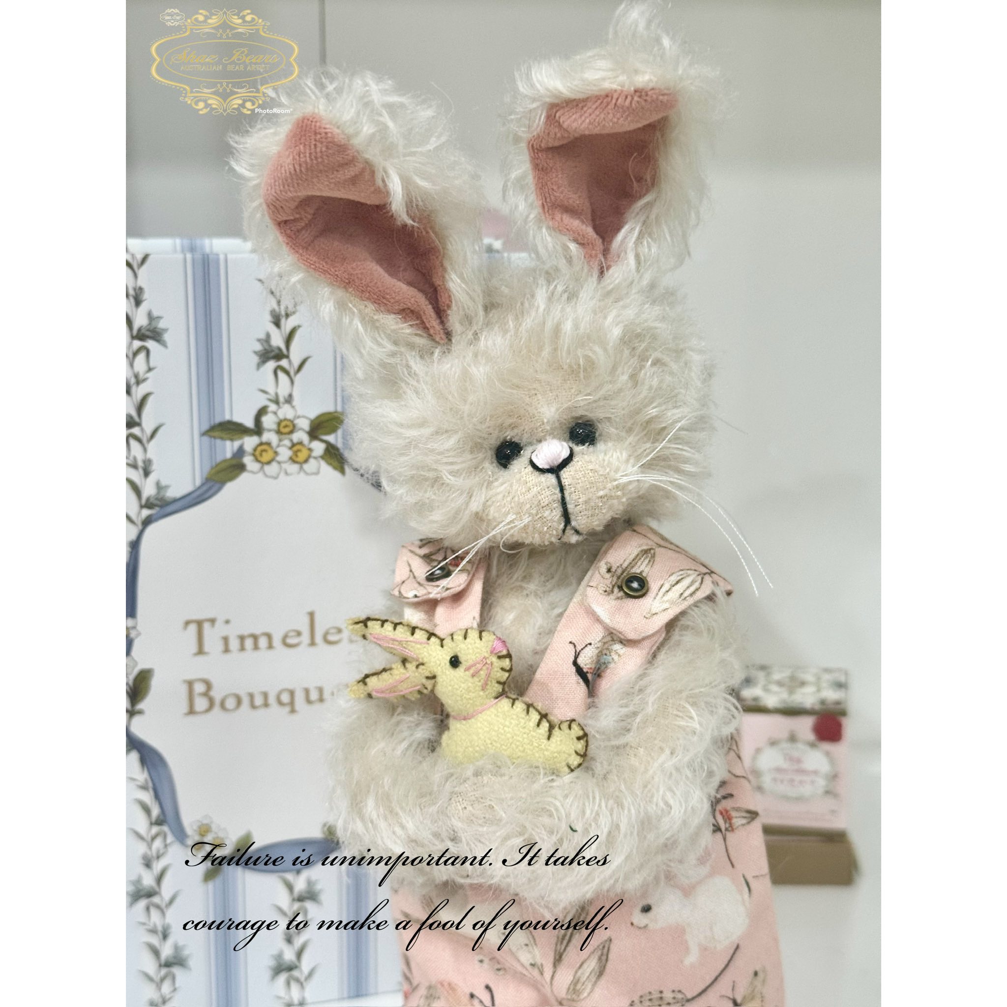 Small beige blossom bunny with blue floral ears?