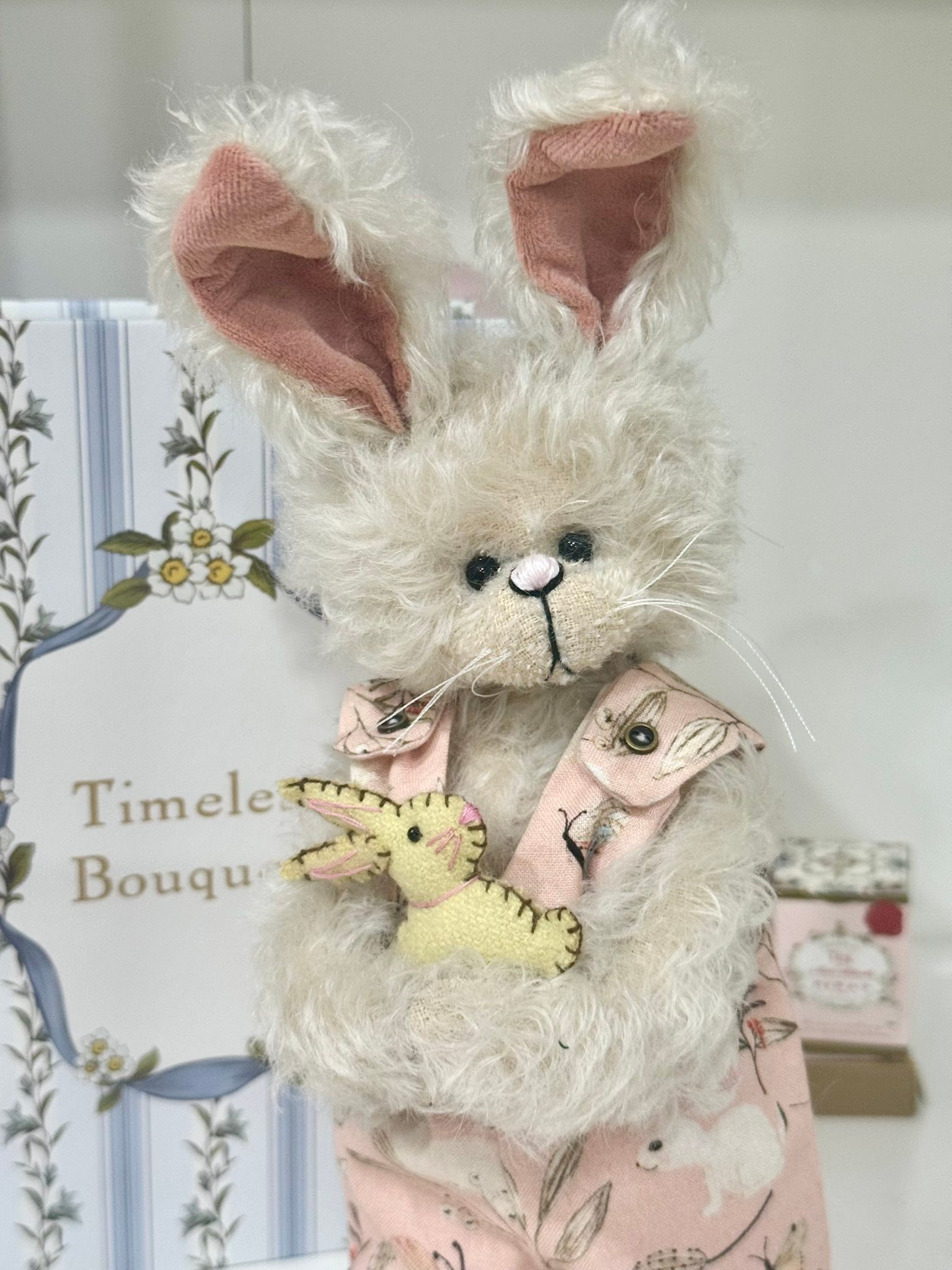Small beige blossom bunny with blue floral ears?