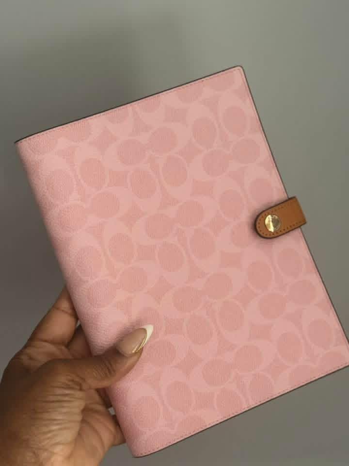 Powder pink coach notebook available now