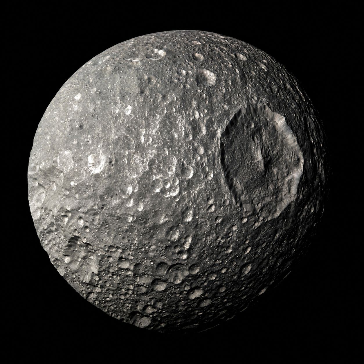 Mimas, Saturn's innermost large moon, is a small, icy world with a