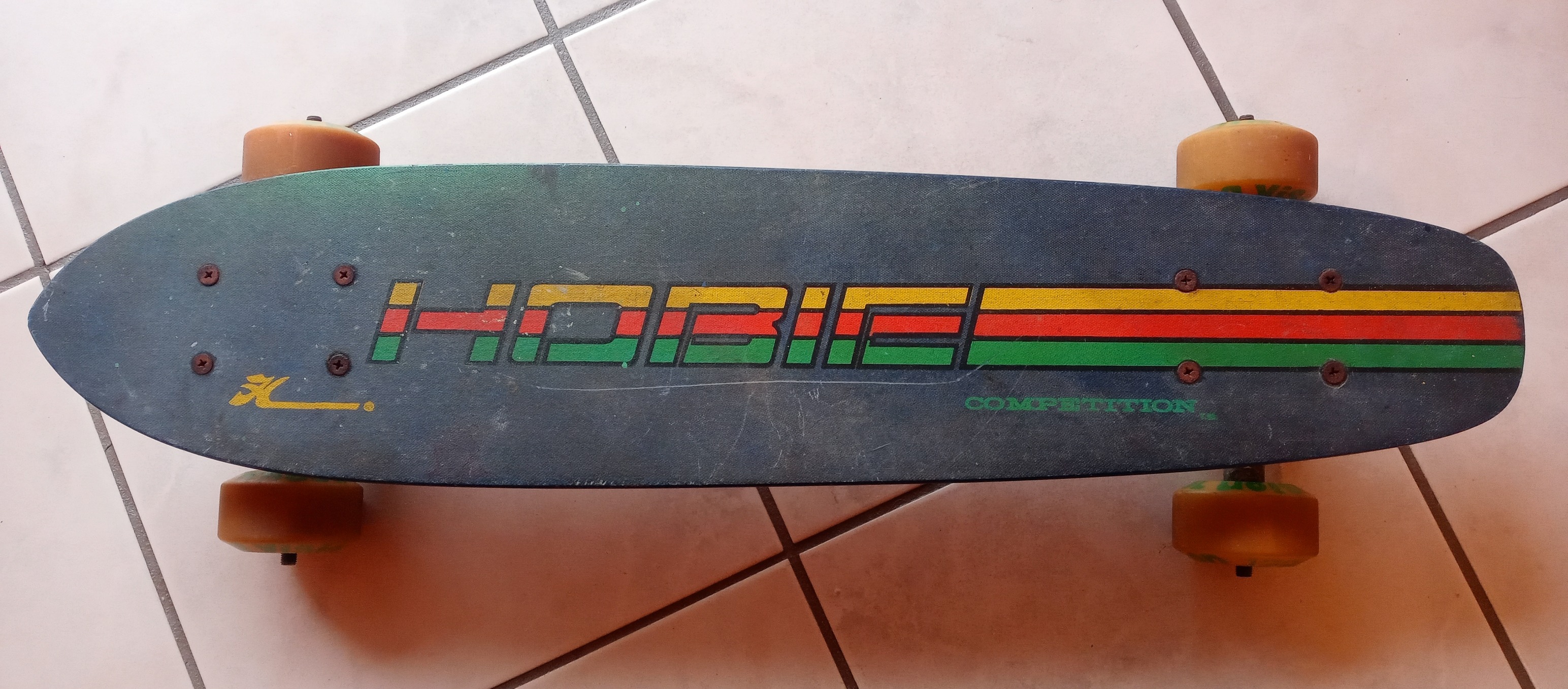Vintage chocolate skate deck with robot graphic