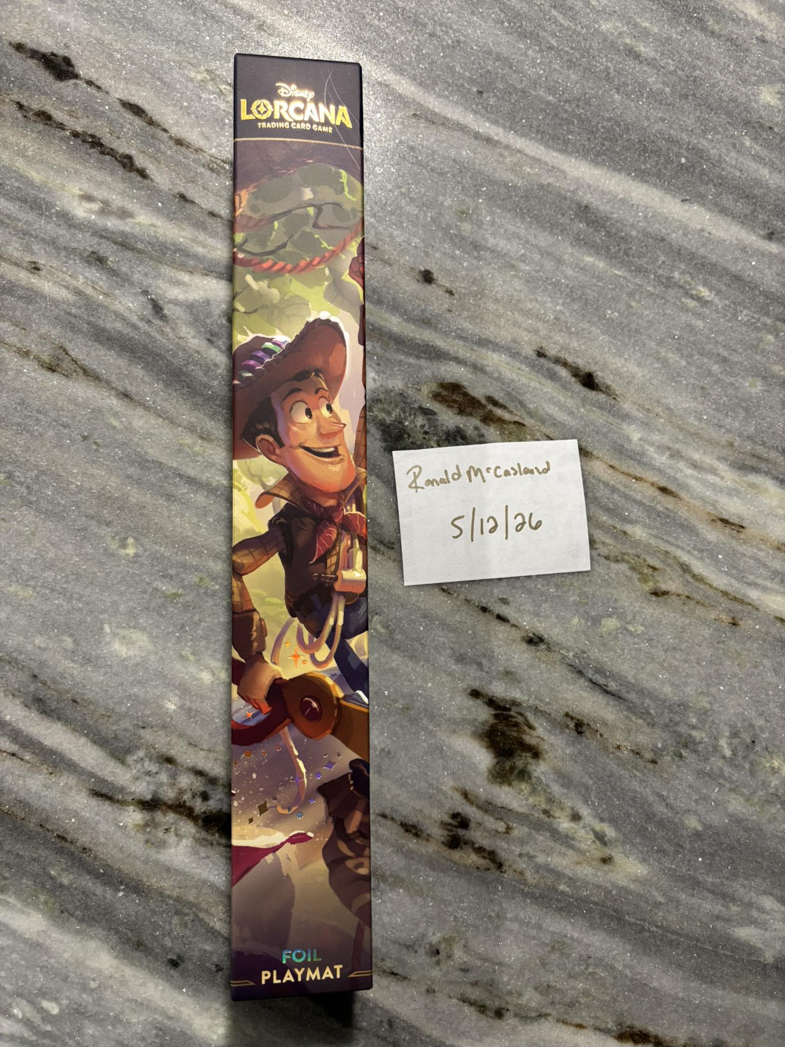 Foil Woody Champion mat from Disney Lorcana TCG