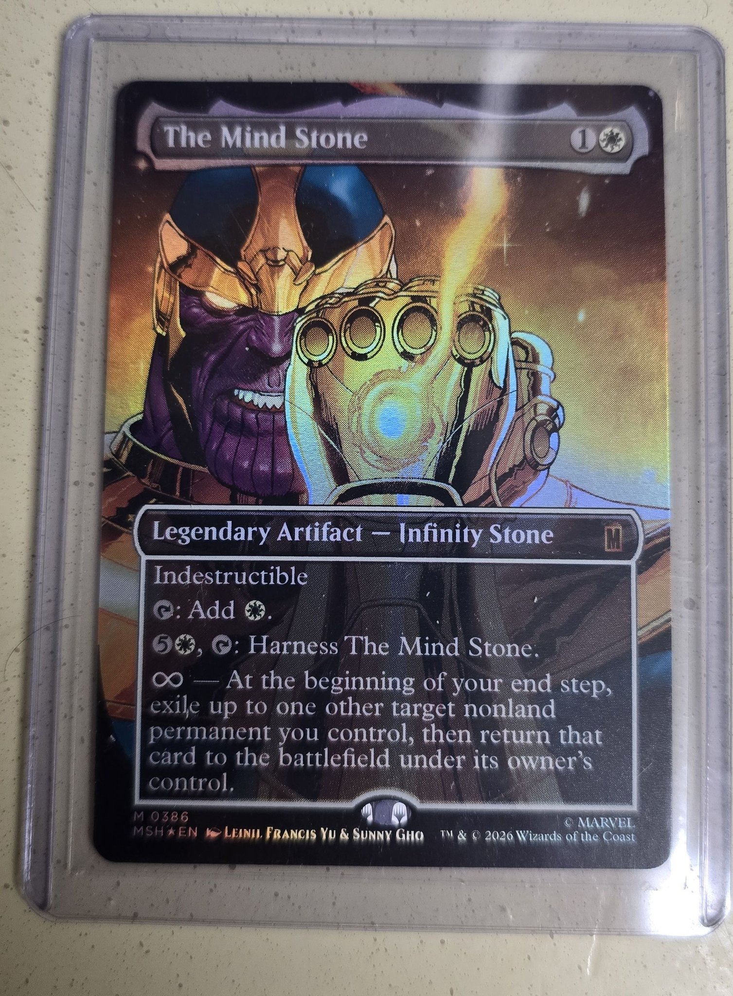 Pulling a foil Mind Stone card from a Magic: the Gathering