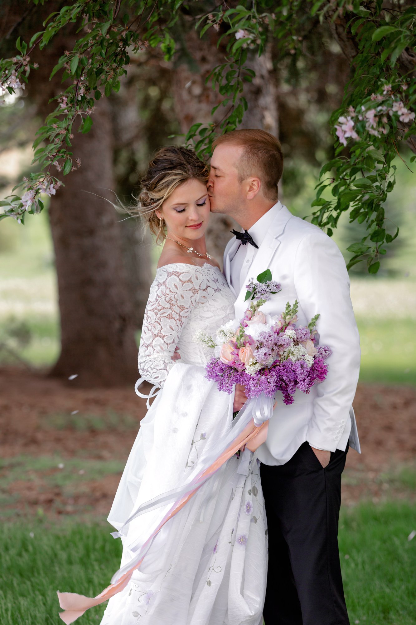 My dress is ivory, and we've been given conflicting advice from different tux shops with some saying the groom & groomsmen should get ivory dress shirts to match it and others saying