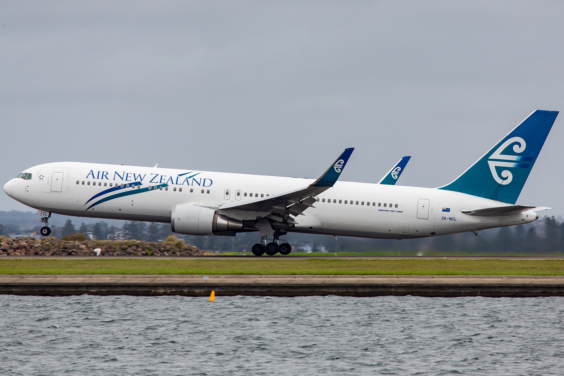 An Air New Zealand Boeing 767-300ER rotates off 16L at Sydney Airport