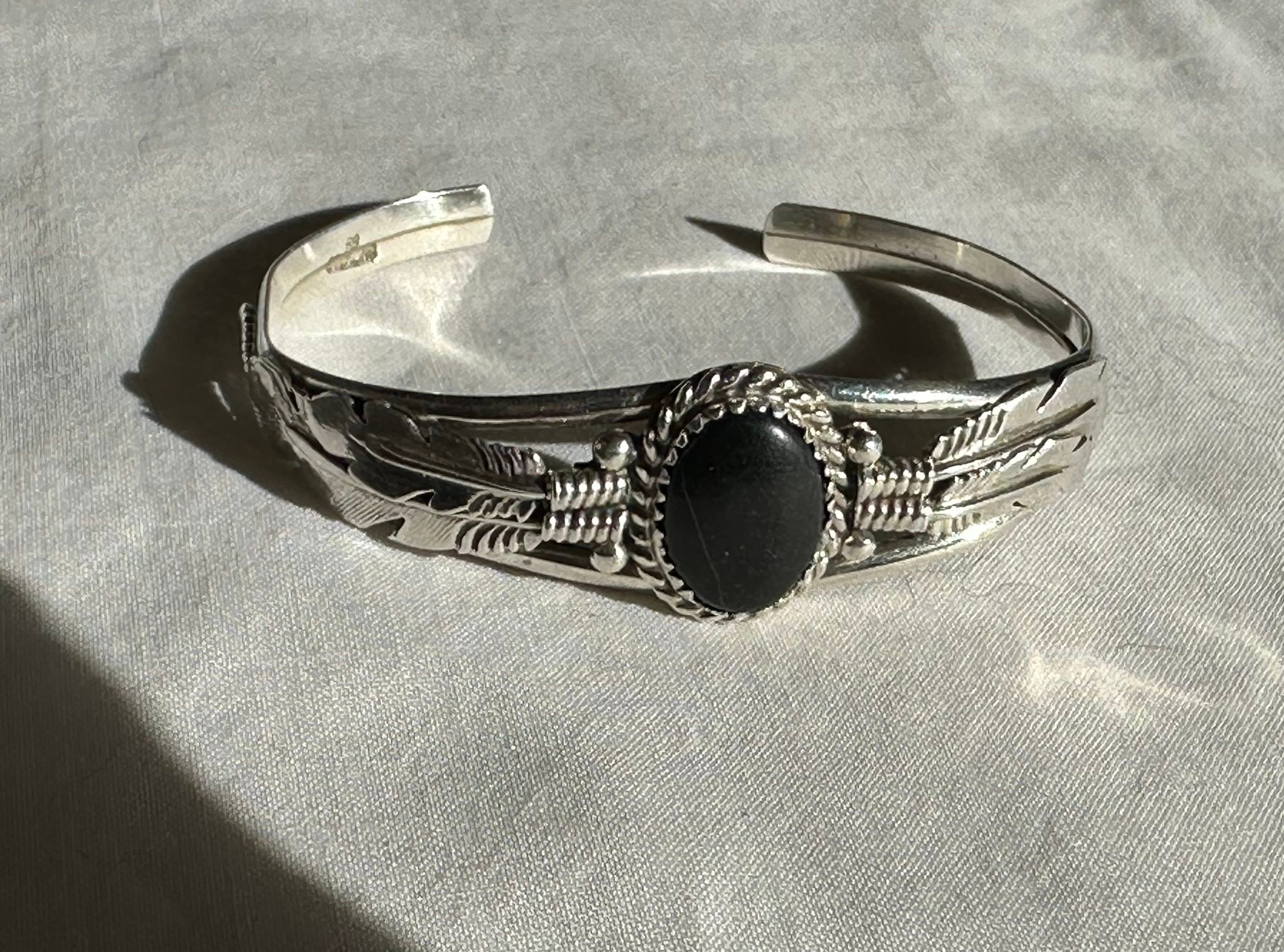 Is this jewelry piece made by Running Bear or Richard Begay?