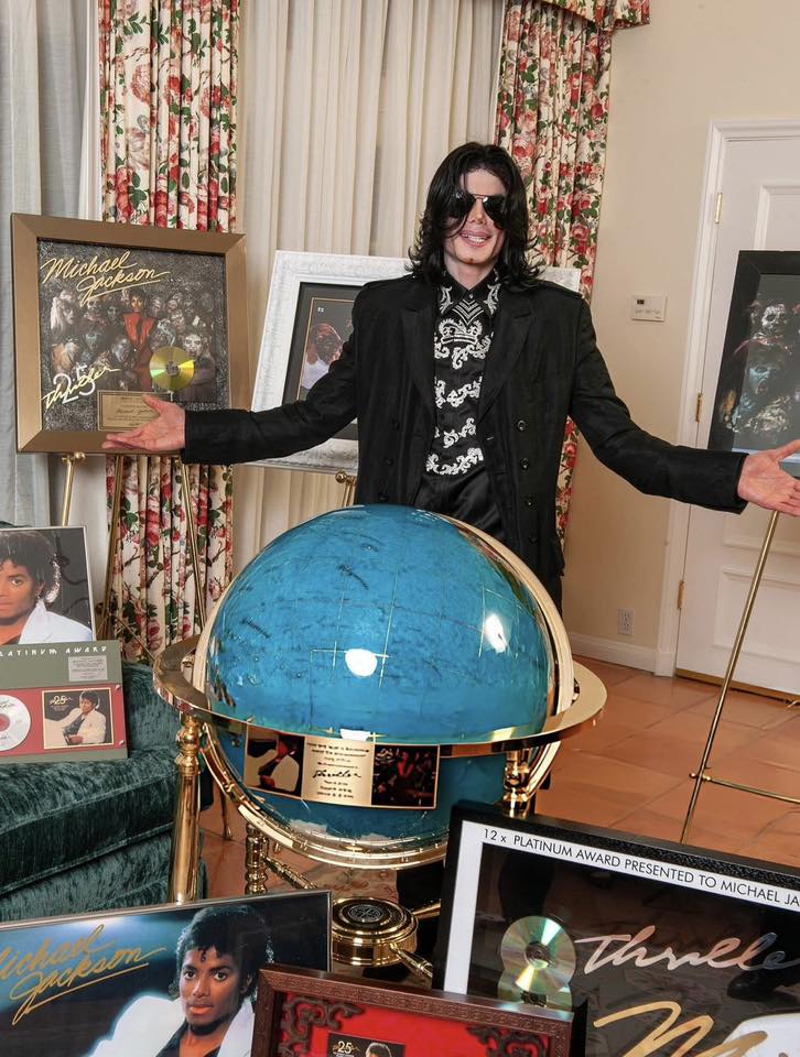 Michael Jackson with Thriller 25 plaque