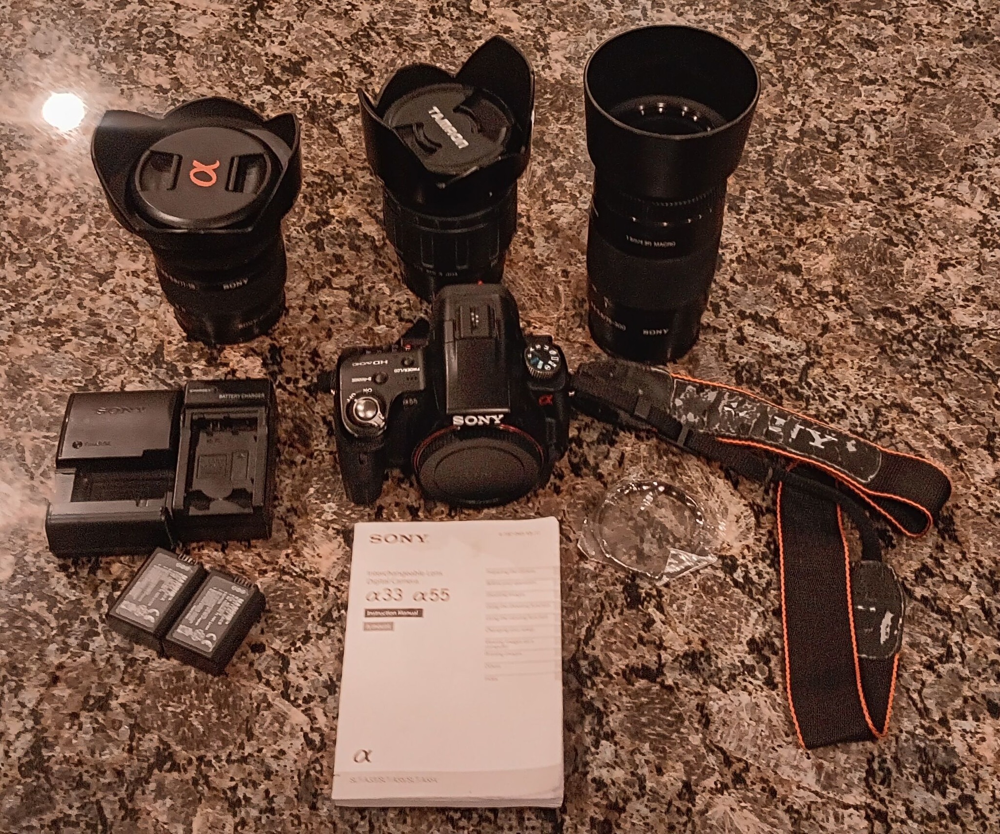 Sony SLT a55v camera with three lenses