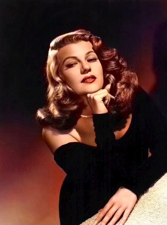 Rita Hayworth in 1948 with guitar and dog