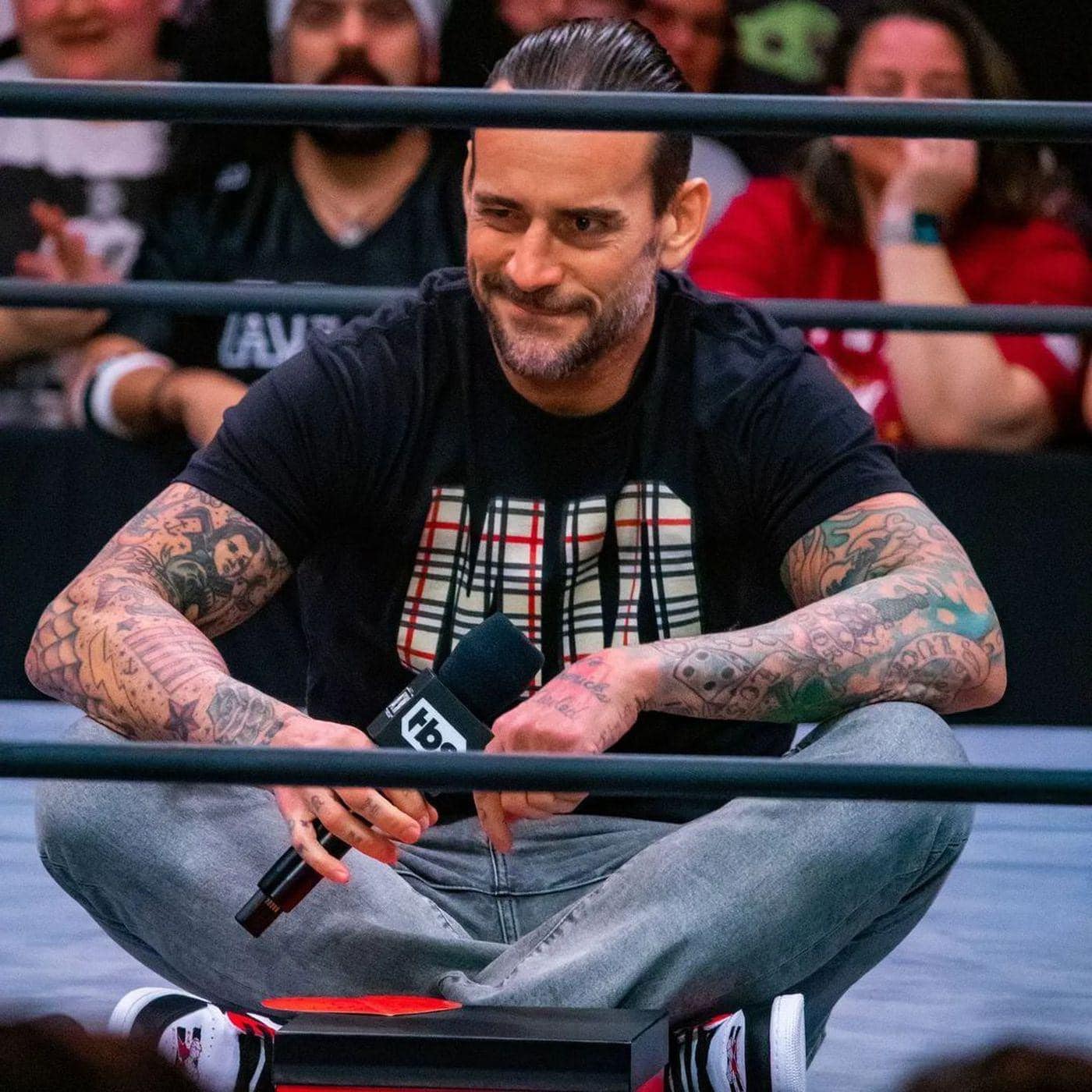Does anybody have the Chicago exclusive CM Punk shirt from his Raw 