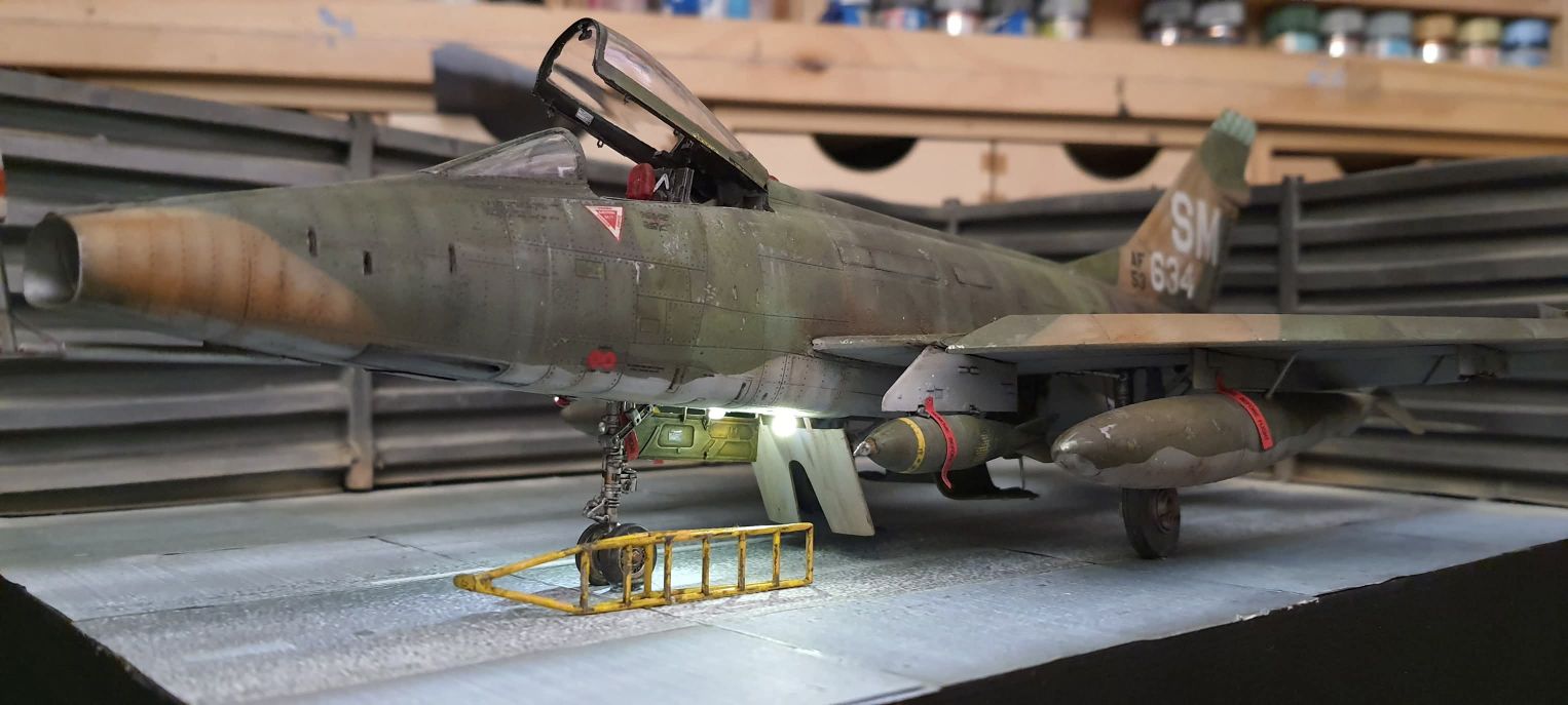 Here is a photo of a South East Asian (SEA) camouflage F-100 Hun