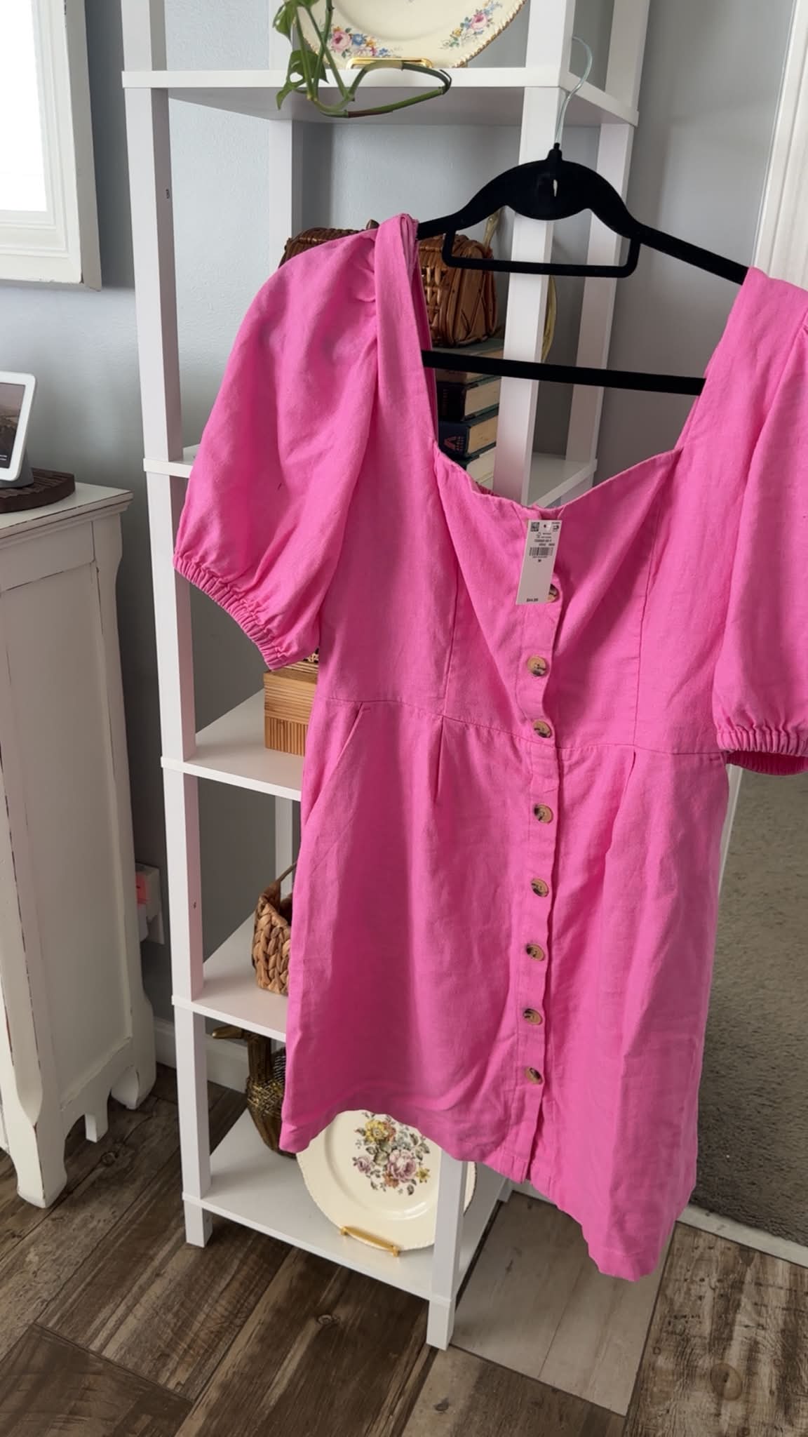 New Old Navy dress is a size Large with a pink and white gingham pattern. It has a smocked bodice and flutter sleeves. The dress is made in India and has the