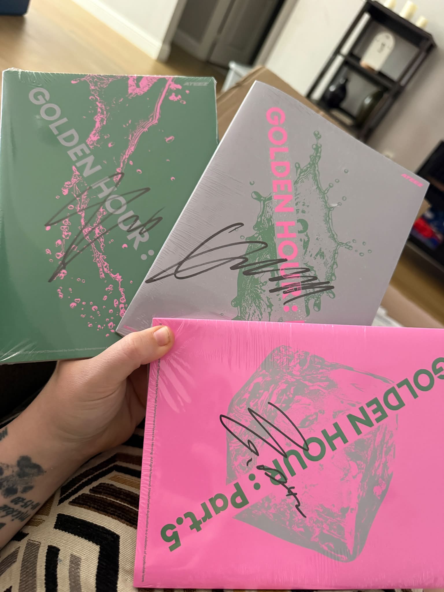 Ateez members' signatures on poster