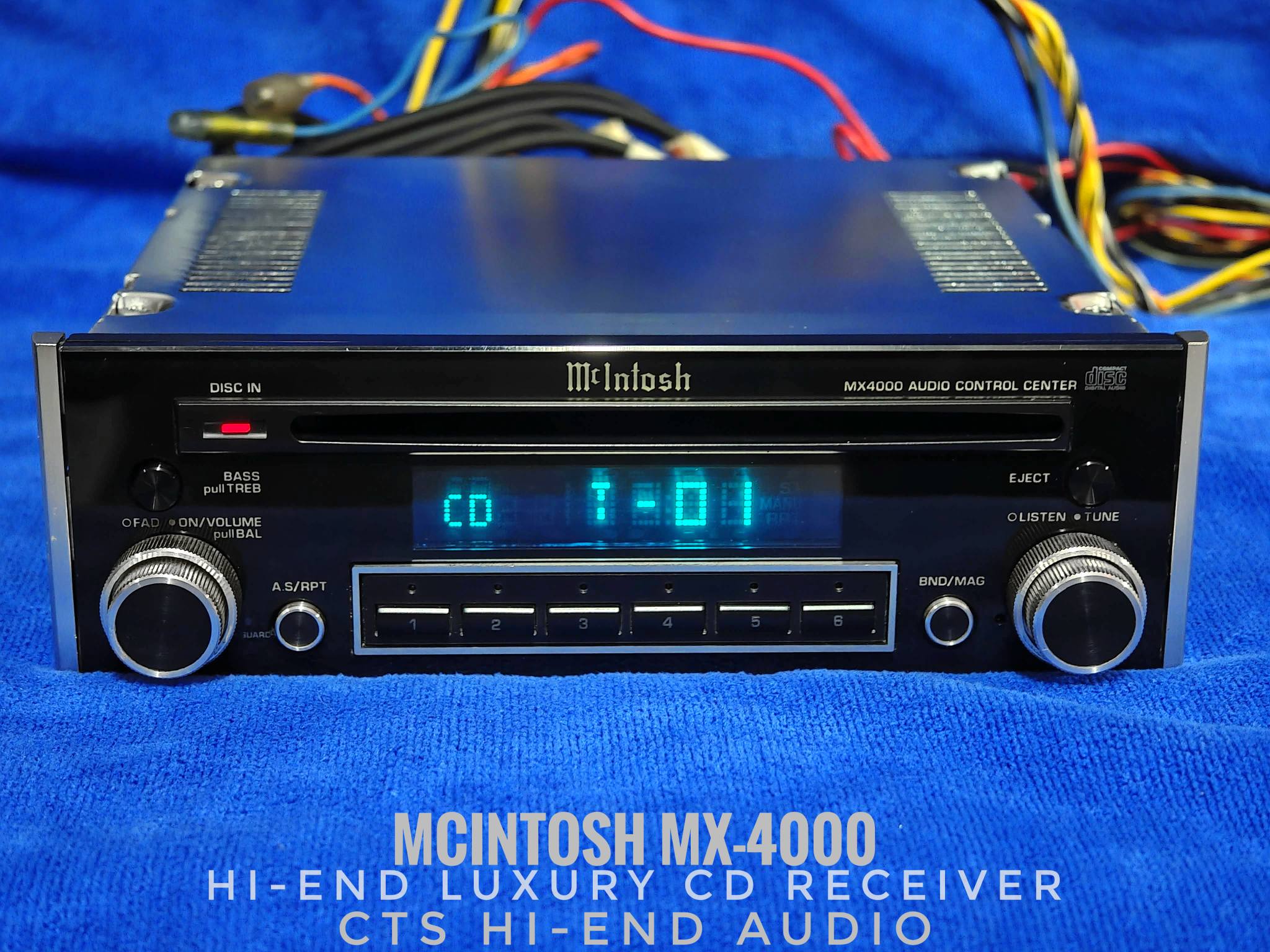 McIntosh MX-4000 CD receiver with blue display and audio control