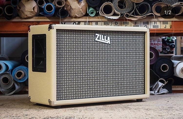Deep small vintage 2x12. Rough blonde tolex, large check grill