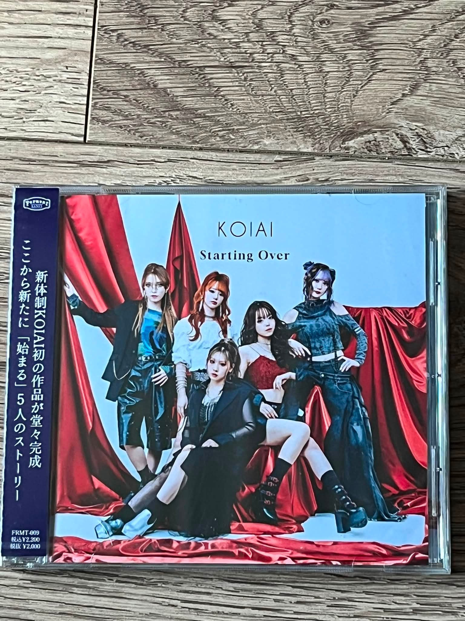 KOIAI's 'Starting Over' CD and bonus metal pin