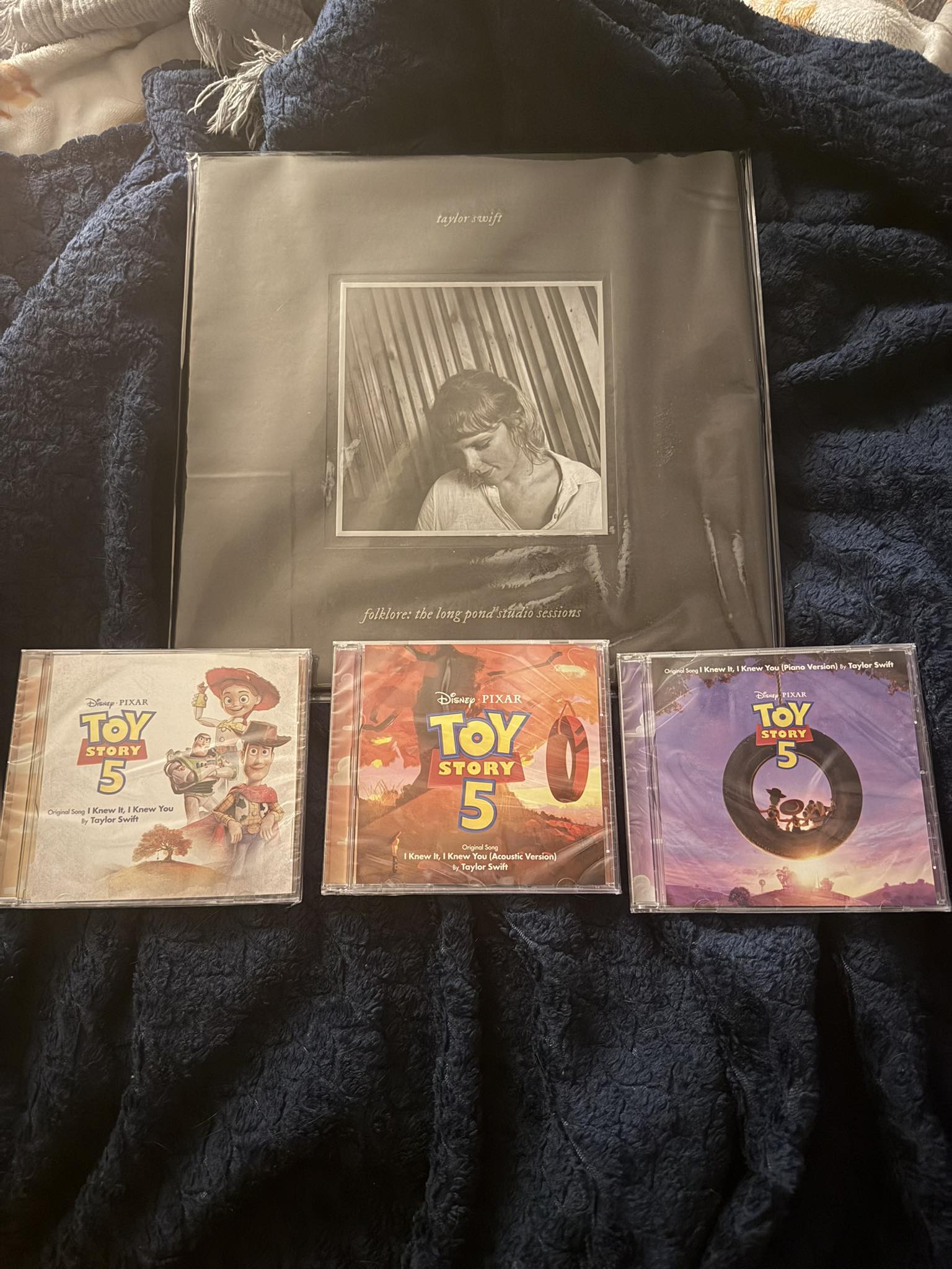 Taylor Swift and Toy Story CDs arrived in the mail