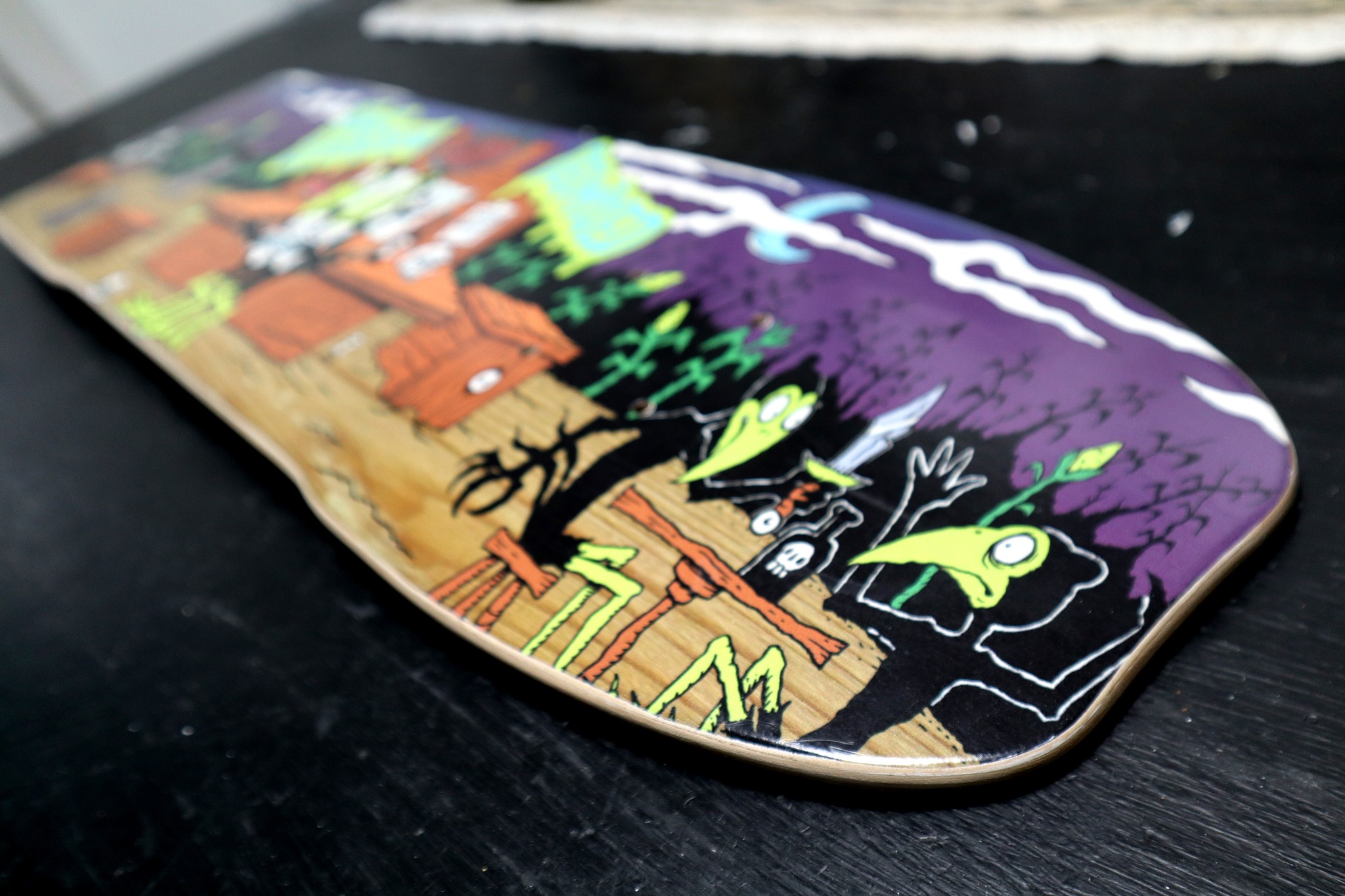 Vintage chocolate skate deck with robot graphic