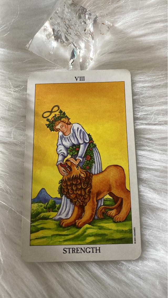 Strength. Tarot Card designed by Pamela Coleman Smith