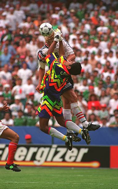 Mexico's Jorge Campos blocks Norway's Jostein Flo at 1994 World
