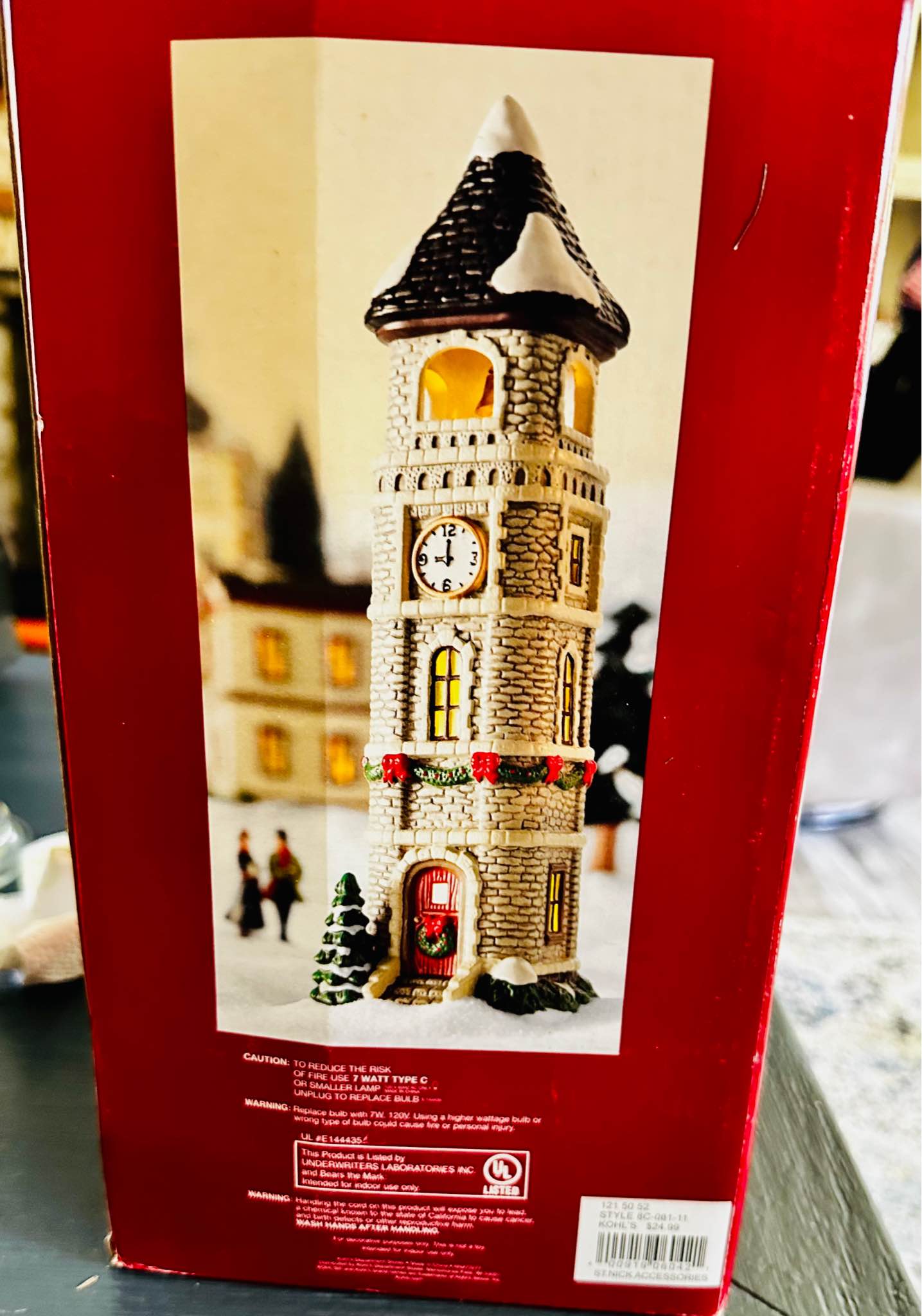 These images show the St. Nicholas Square Village Collection Clock