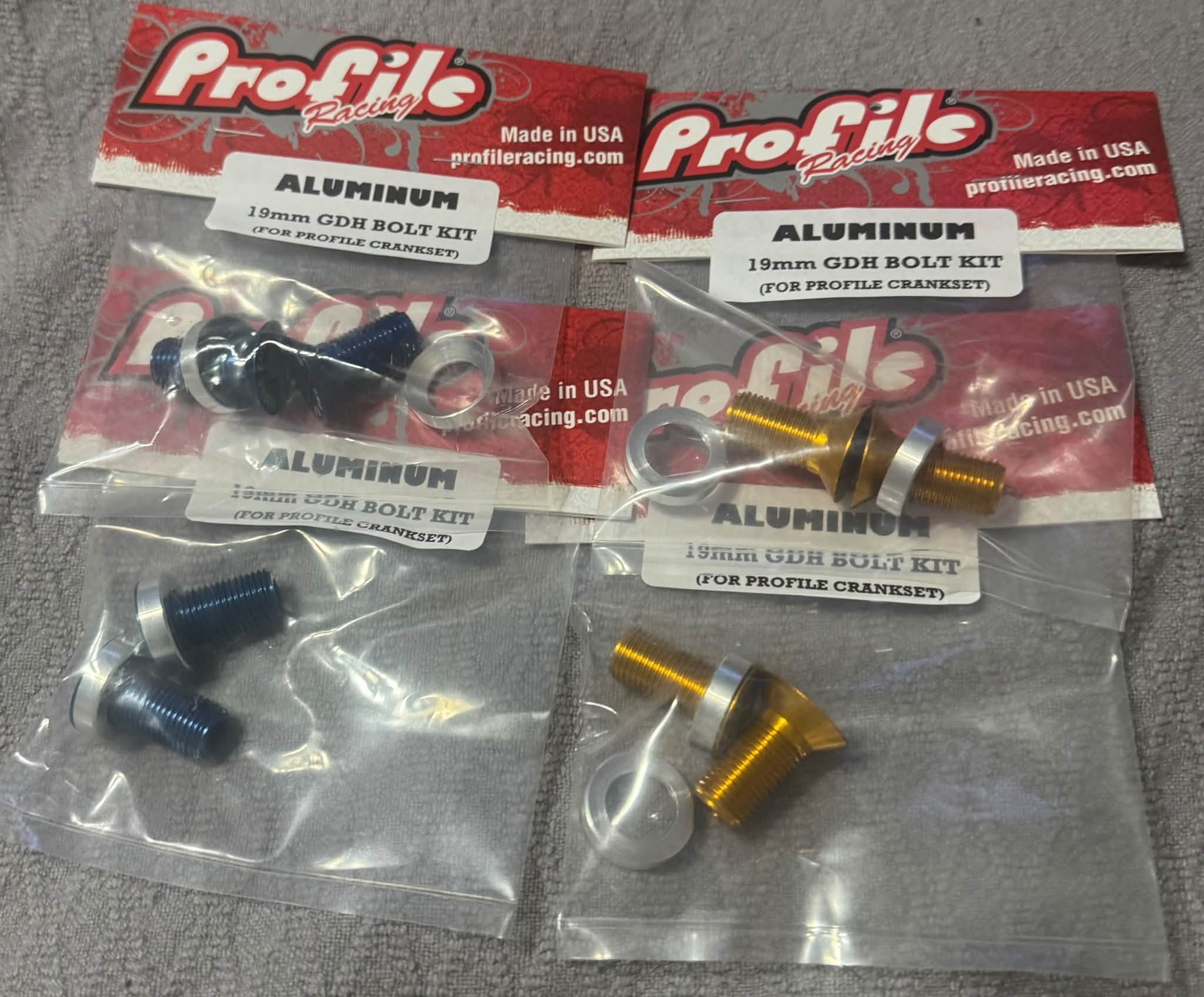 Anodized GDH 19mm spindle bolts in blue and gold from Profile Racing