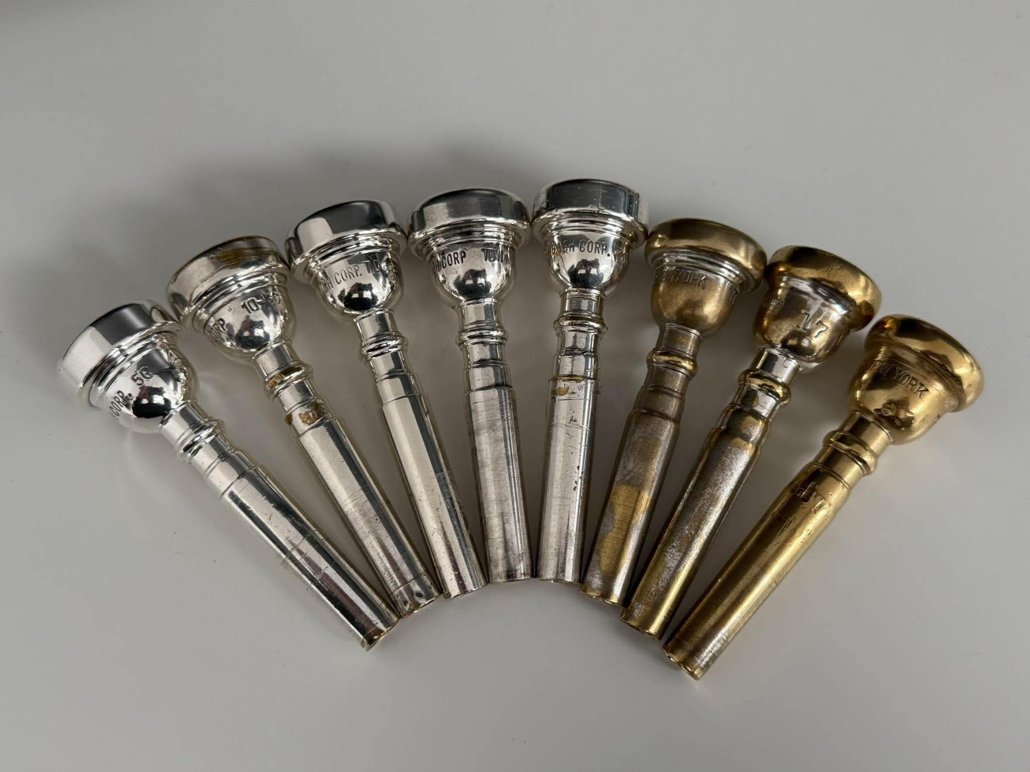 mouthpieces L→R Vincent Bach Corp 1C FL Viercent Bach 3C (gold 