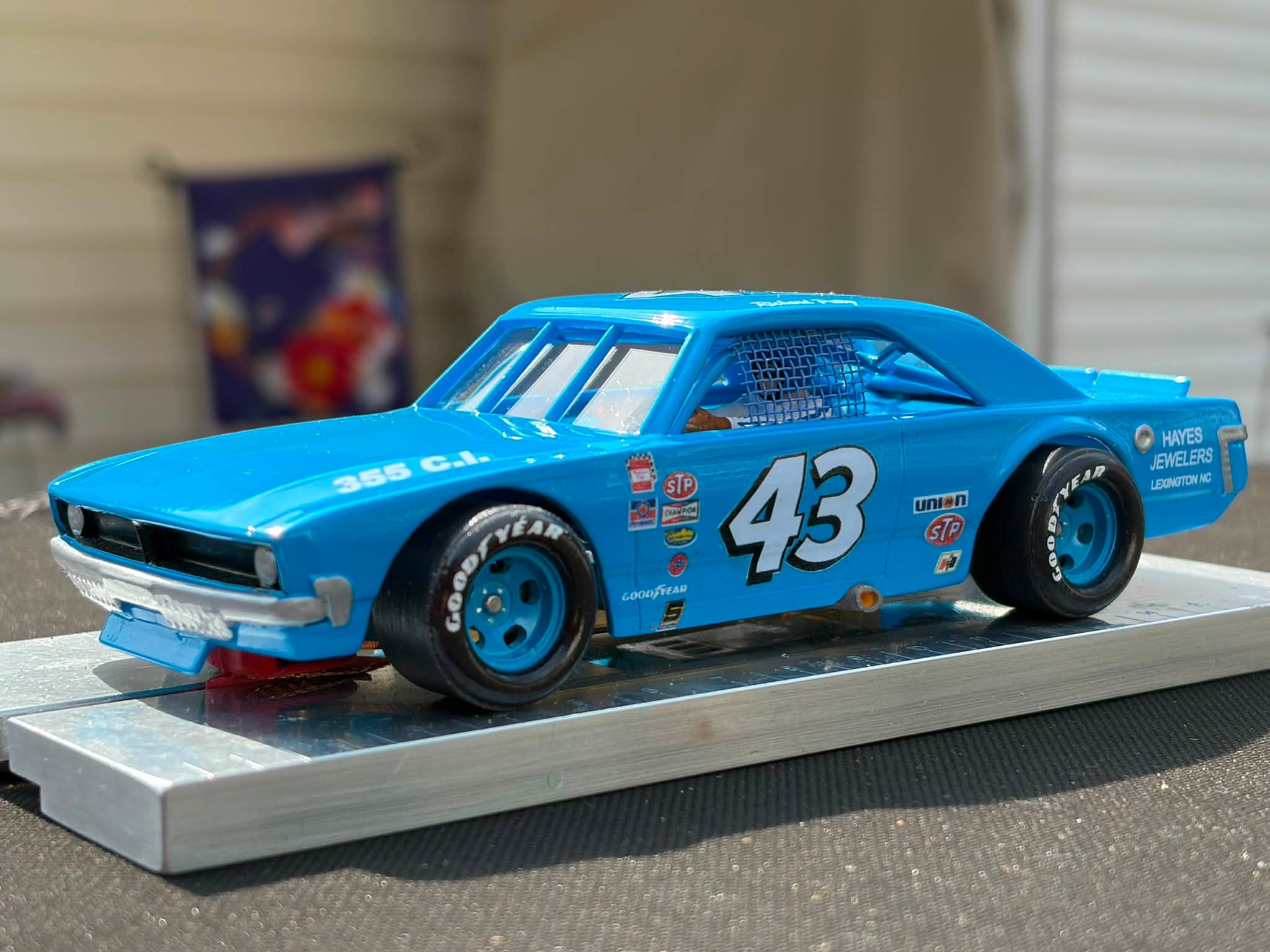 Junior's old Carrera car wins with a 2.438 time