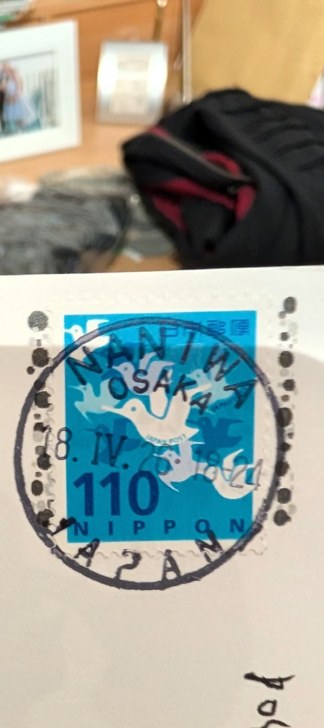 What does 18-24 mean on Osaka postcard?