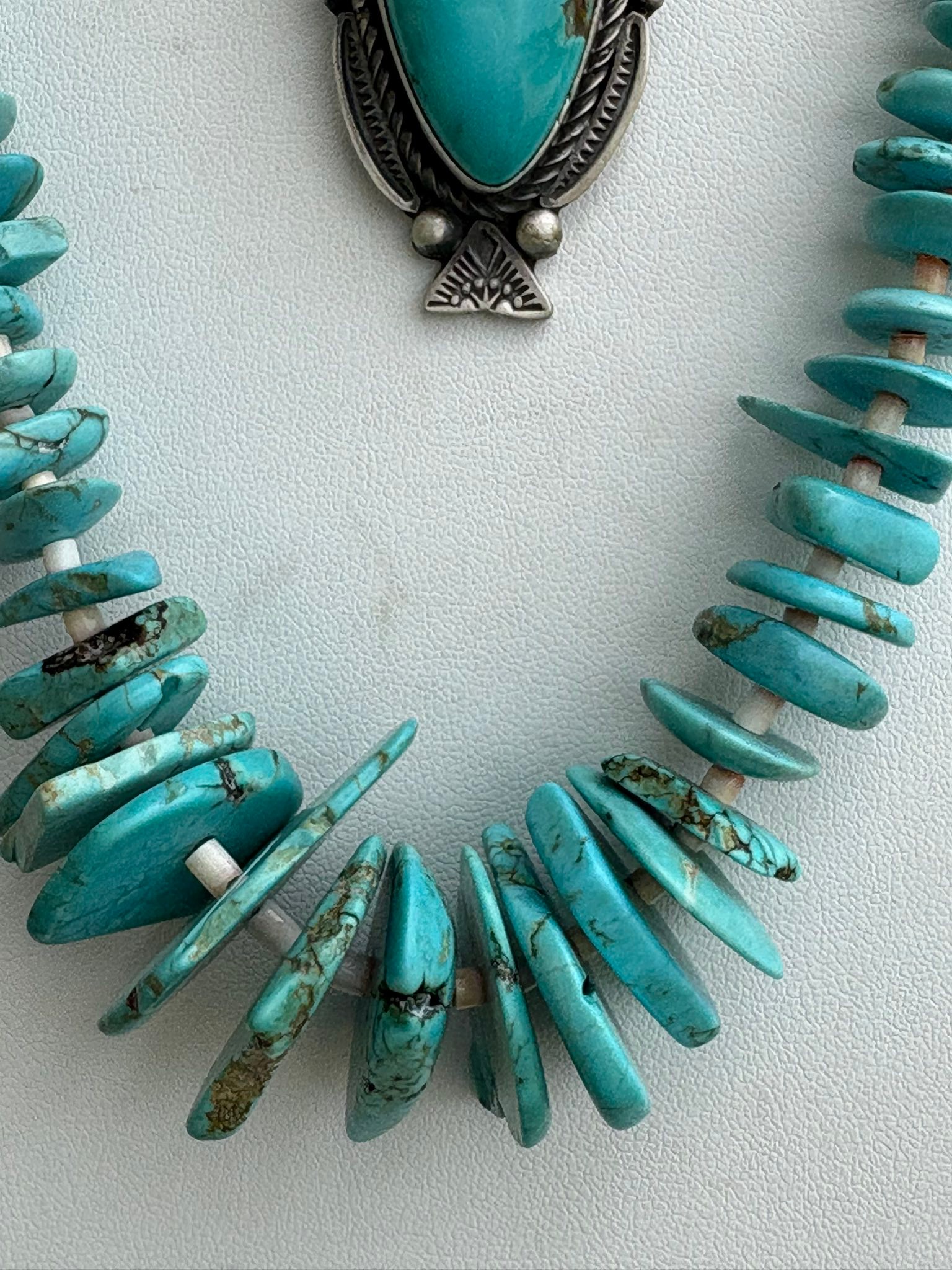 Native American artist Ronald Tom's sterling silver and Pilot