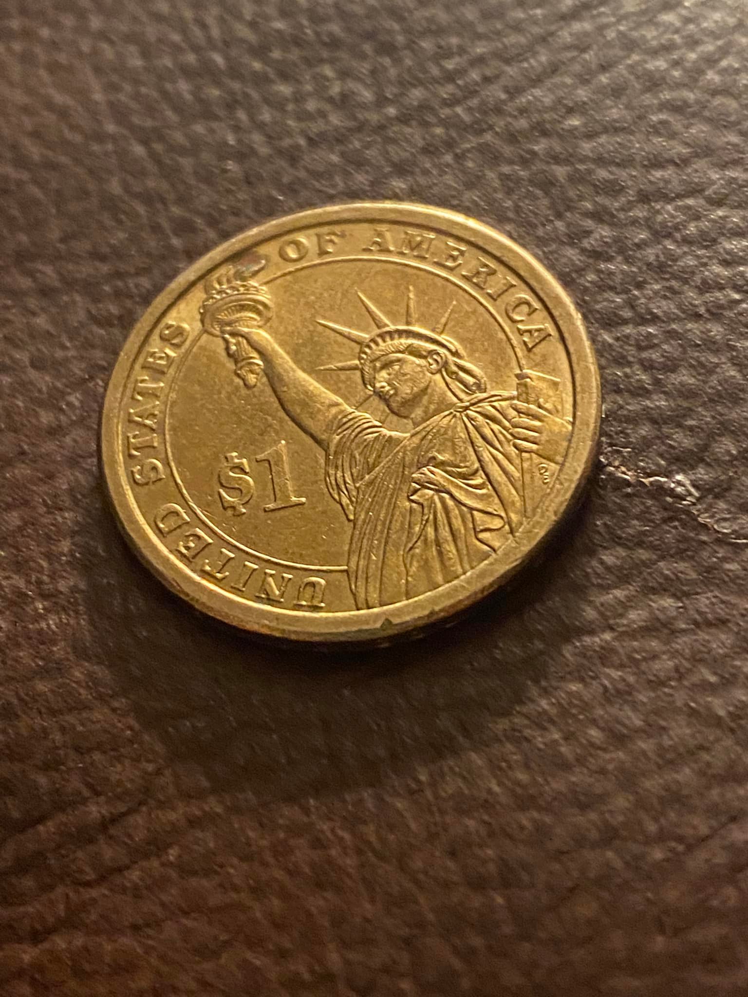 Can you help me identify this coin? It has writing around the edge