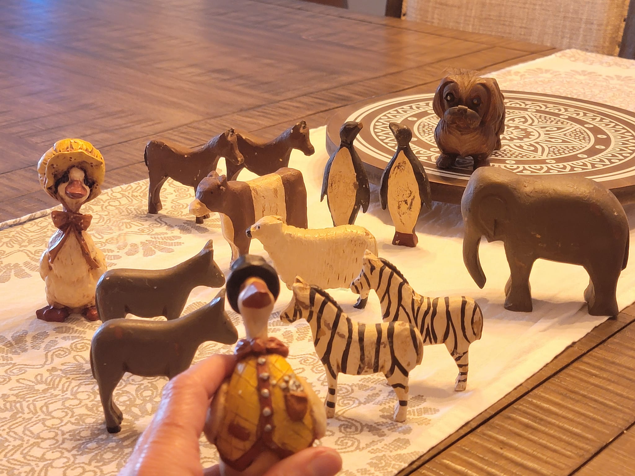 Collecting hand-carved wooden animal figurines display picture 1