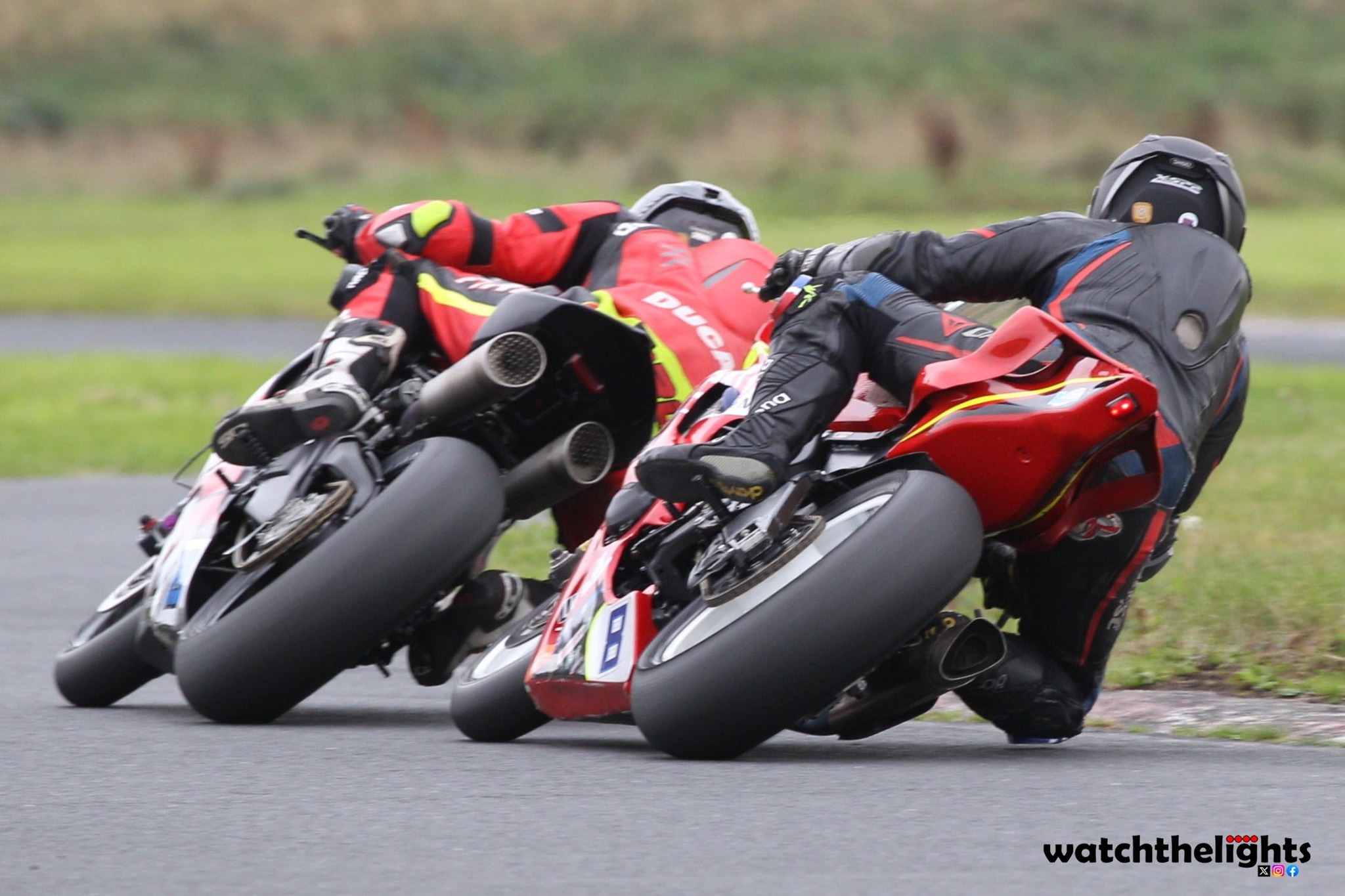 Mark Conlin on his V2 Ducati ahead of Christian Elkin on his