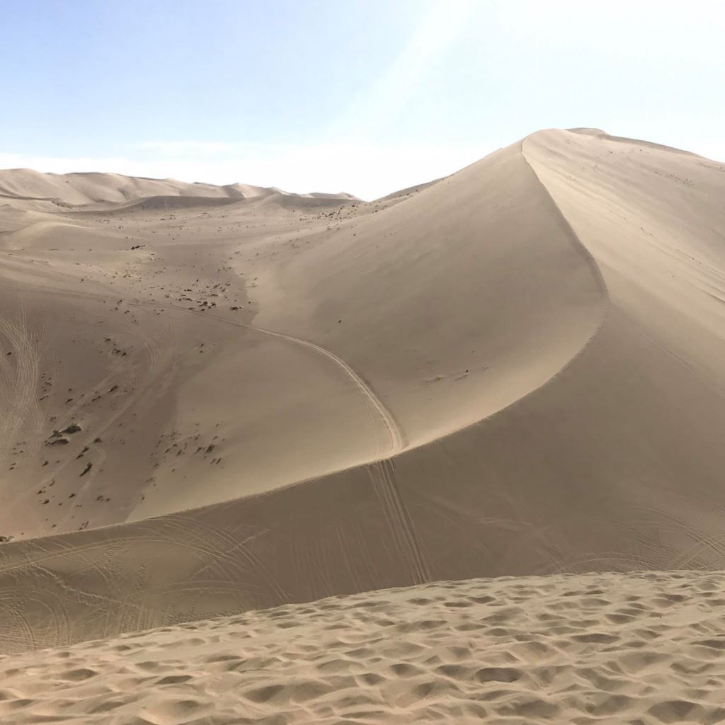 Listen to sand sing. (No really!) Go to the Gobi Desert in Asia or