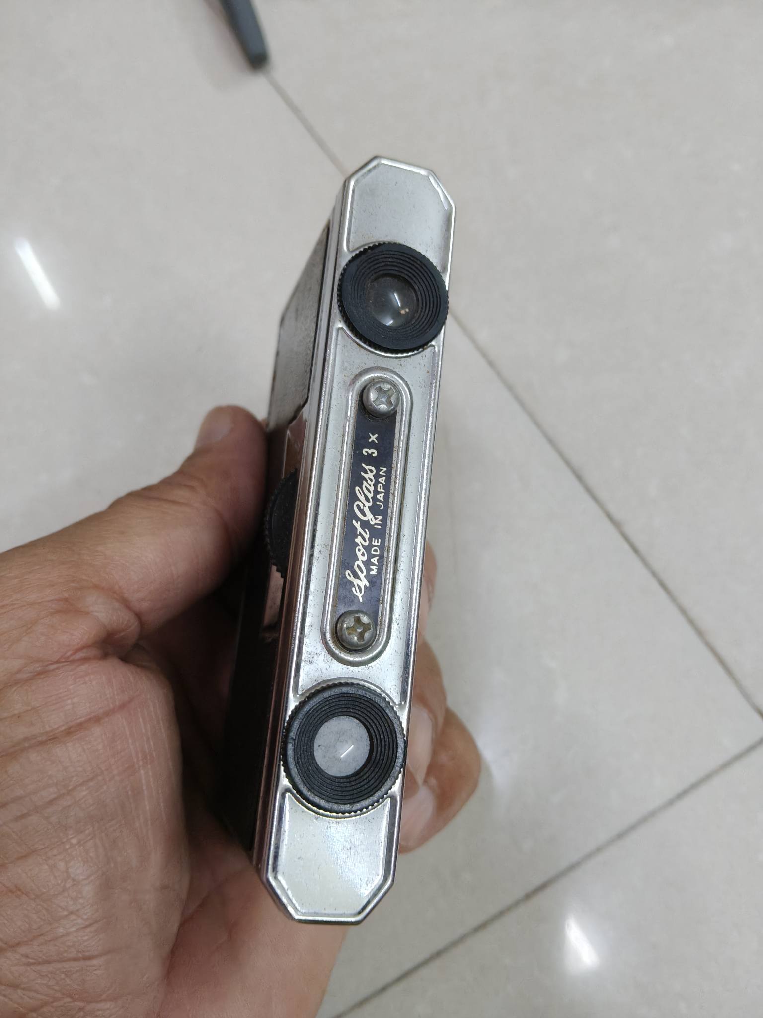 An old collectible vintage folding pocket Binocular, MADE IN JAPAN