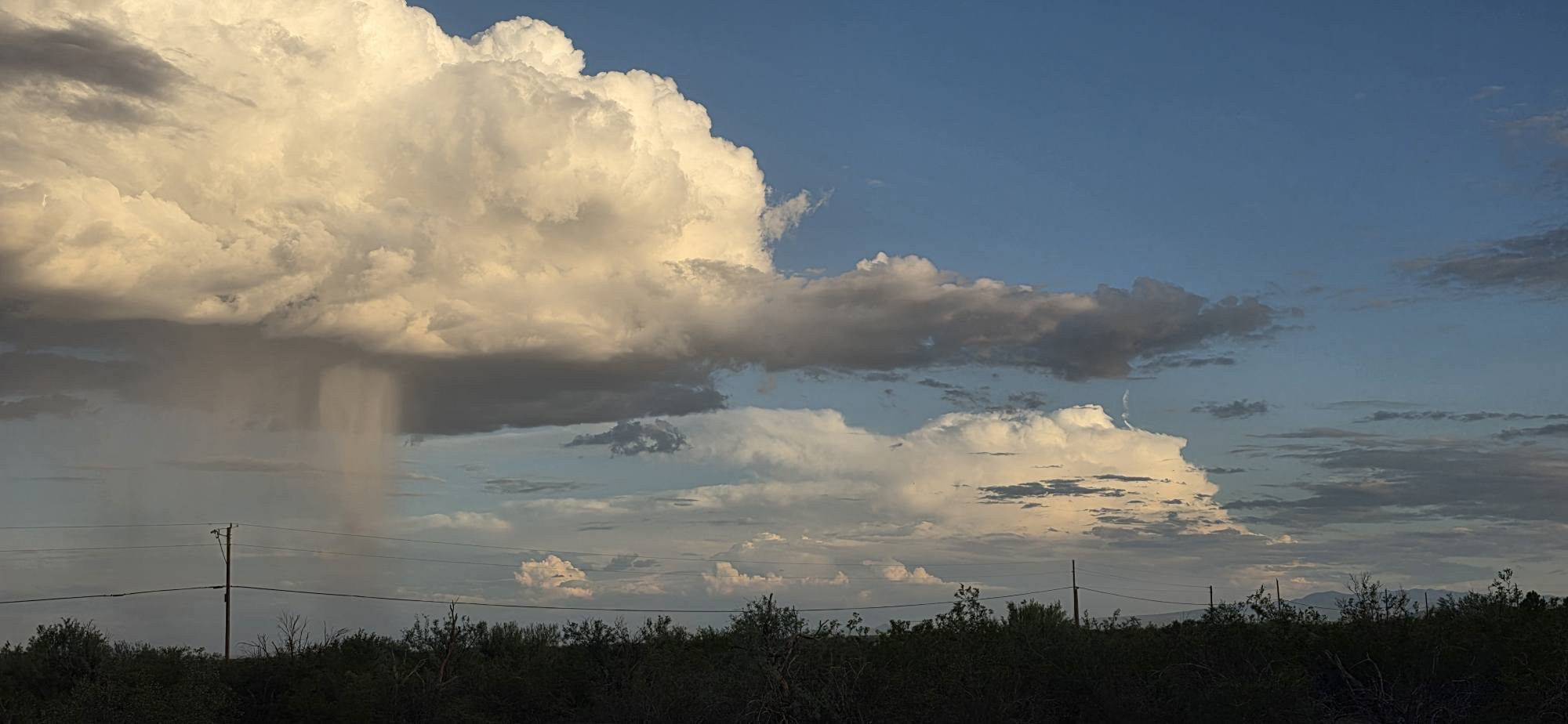 Just a little rain as the sun goes down. Avra Valley, Arizona USA
