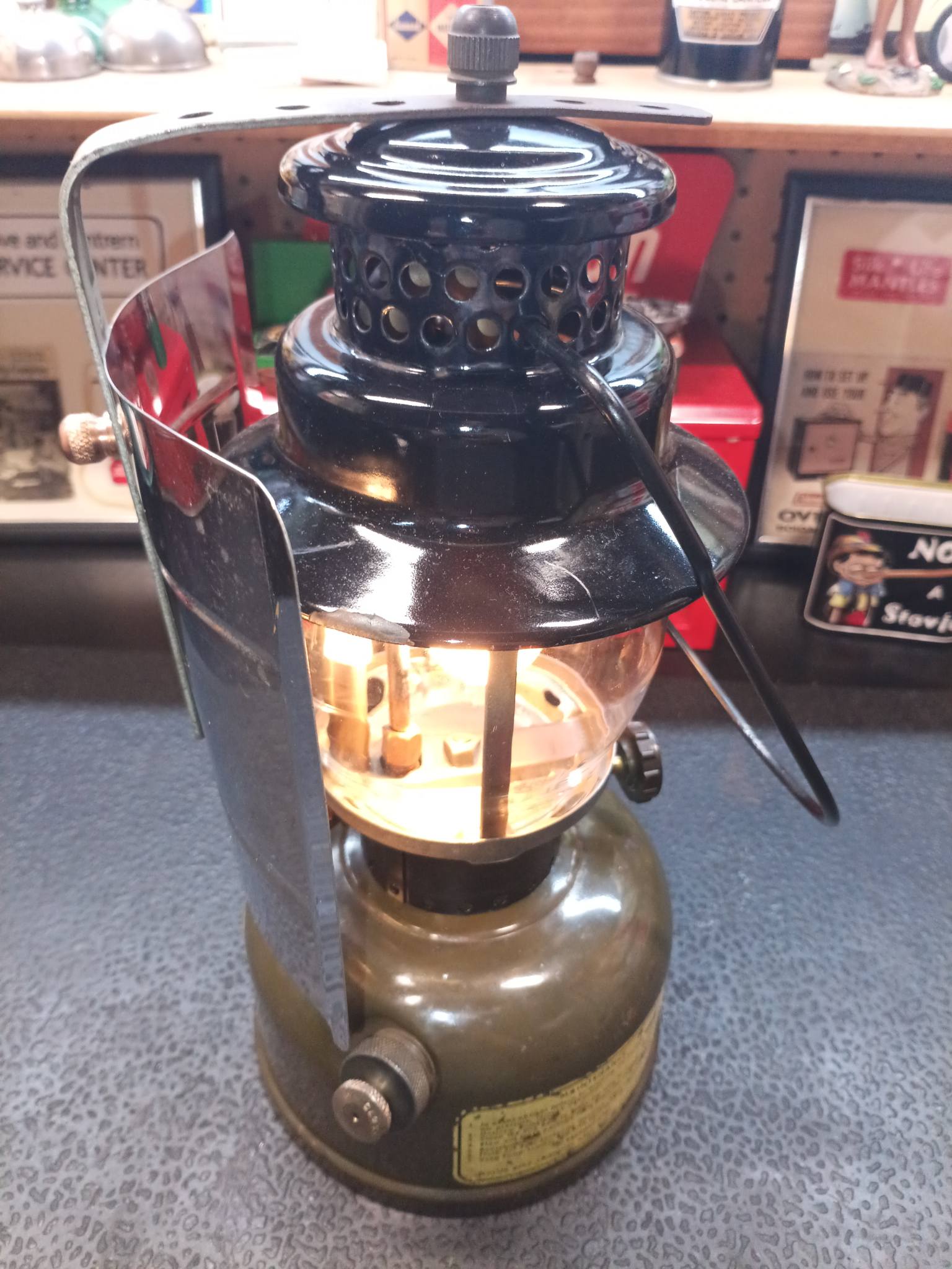 Coleman 236 lantern with dark blue ventilator and brass fount