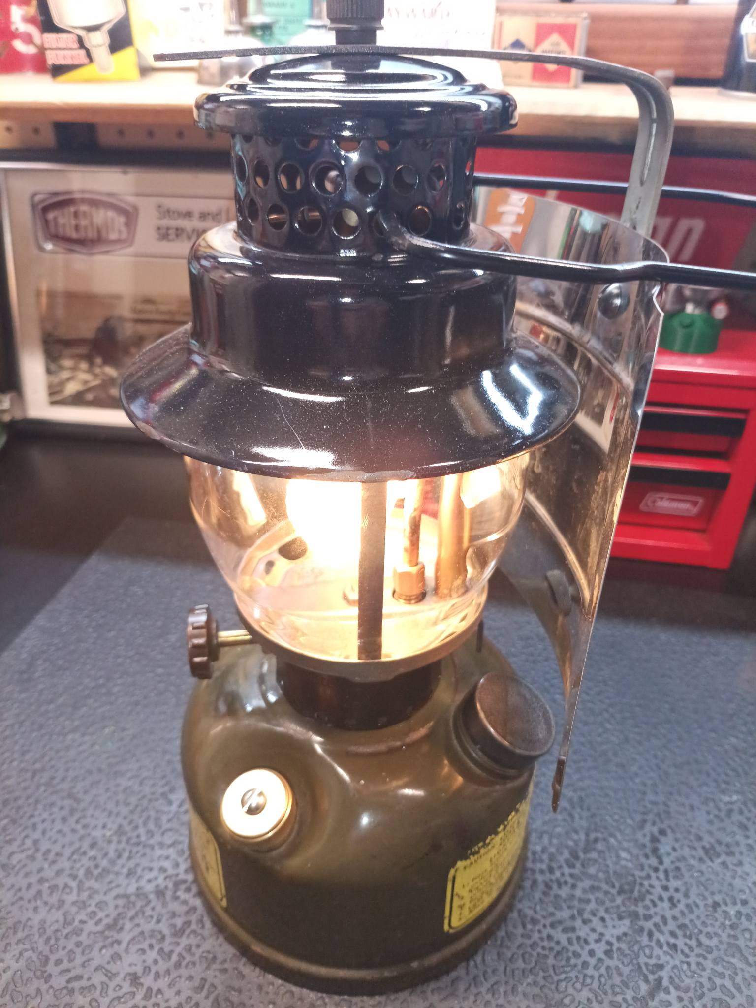 Coleman 236 lantern with dark blue ventilator and brass fount