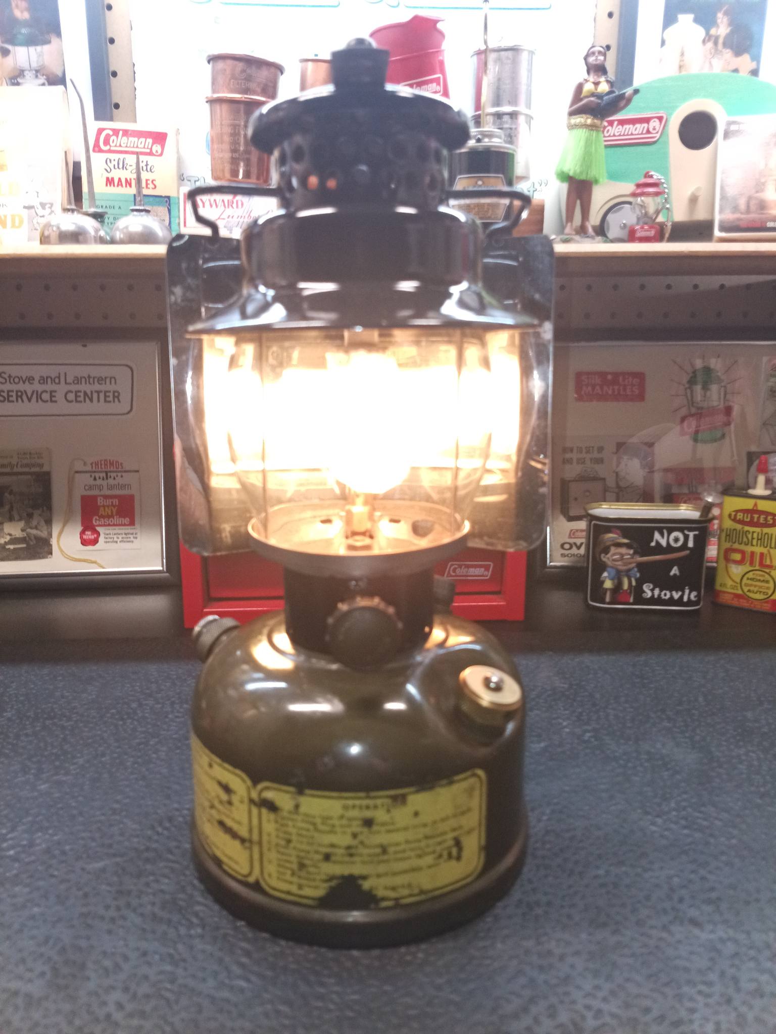 Coleman 236 lantern with dark blue ventilator and brass fount