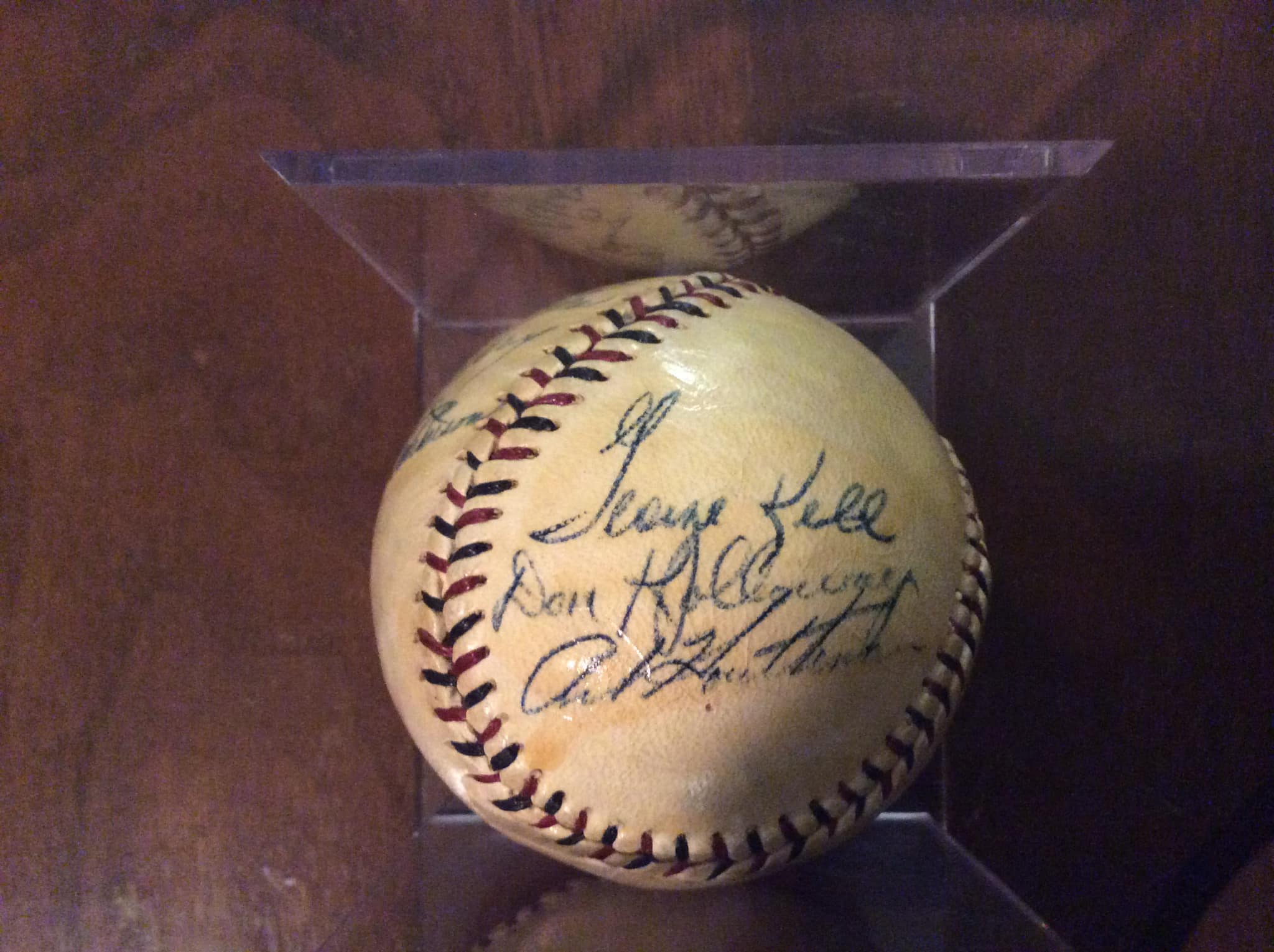 TBT A member of the Detroit Tigers Baseball Team autographs a ball