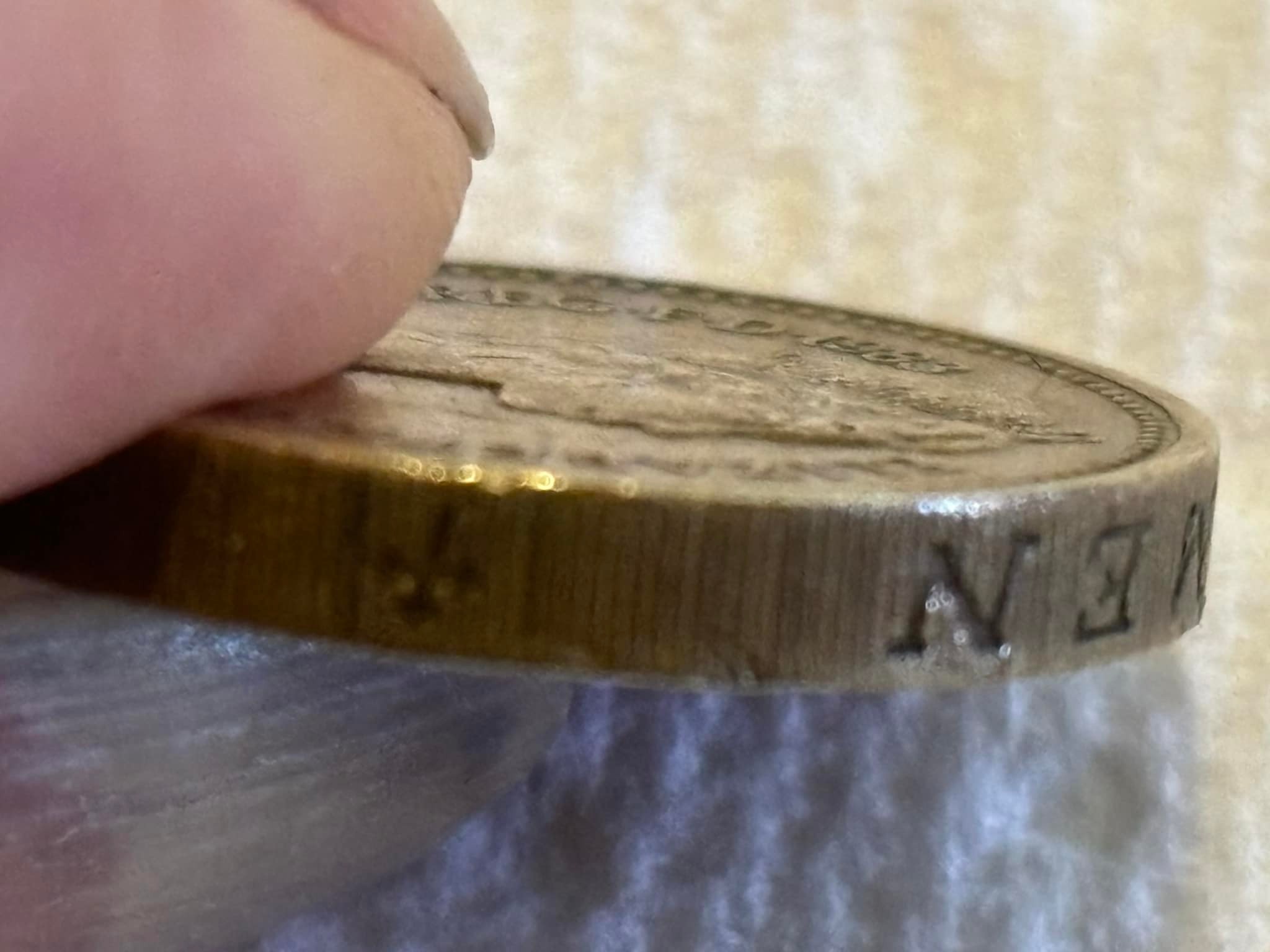 Is this 1983 error coin with upside down Queen Elizabeth II