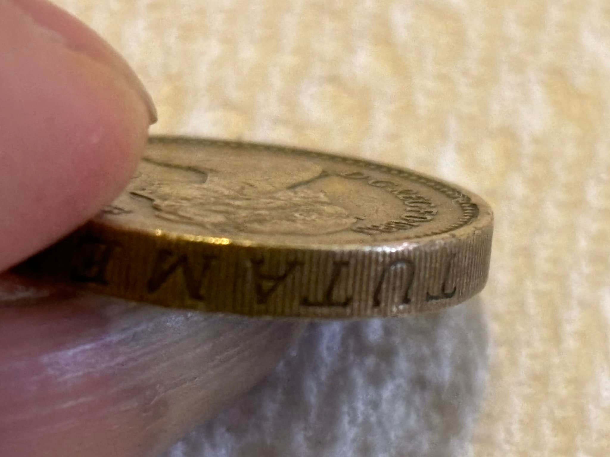 Is this 1983 error coin with upside down Queen Elizabeth II